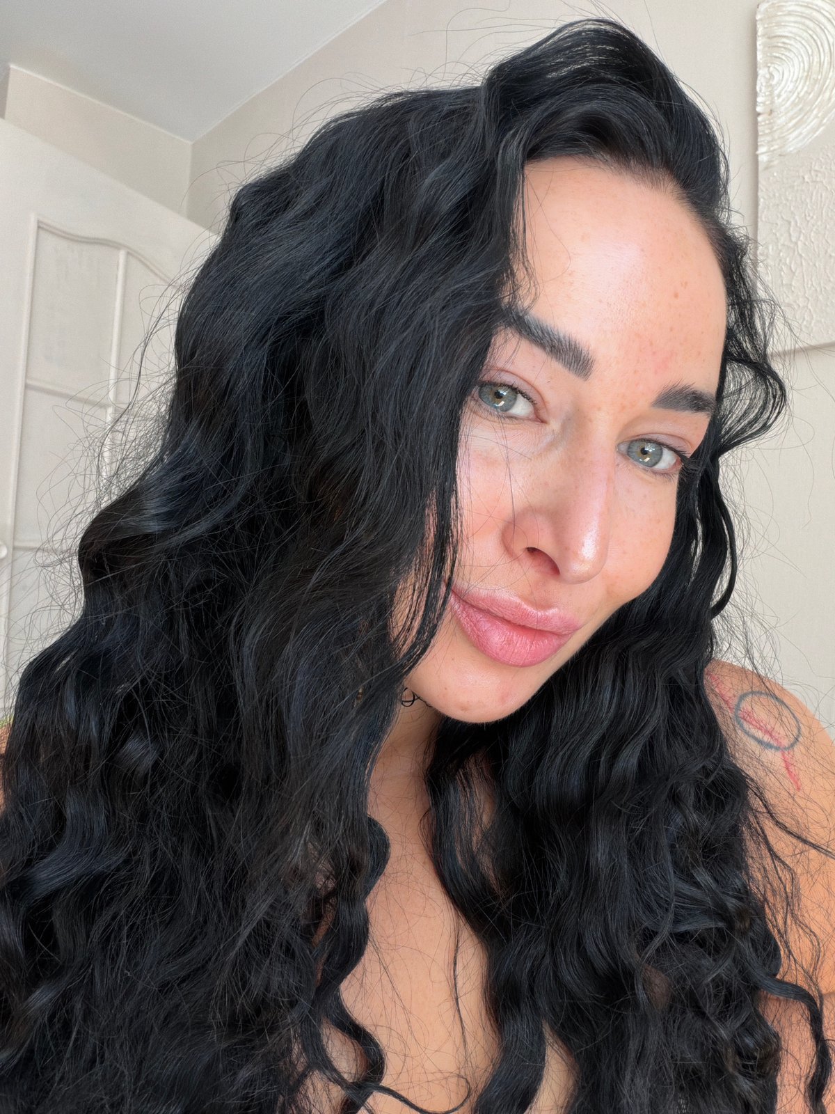Woman with freckles photographed in close-up portraits