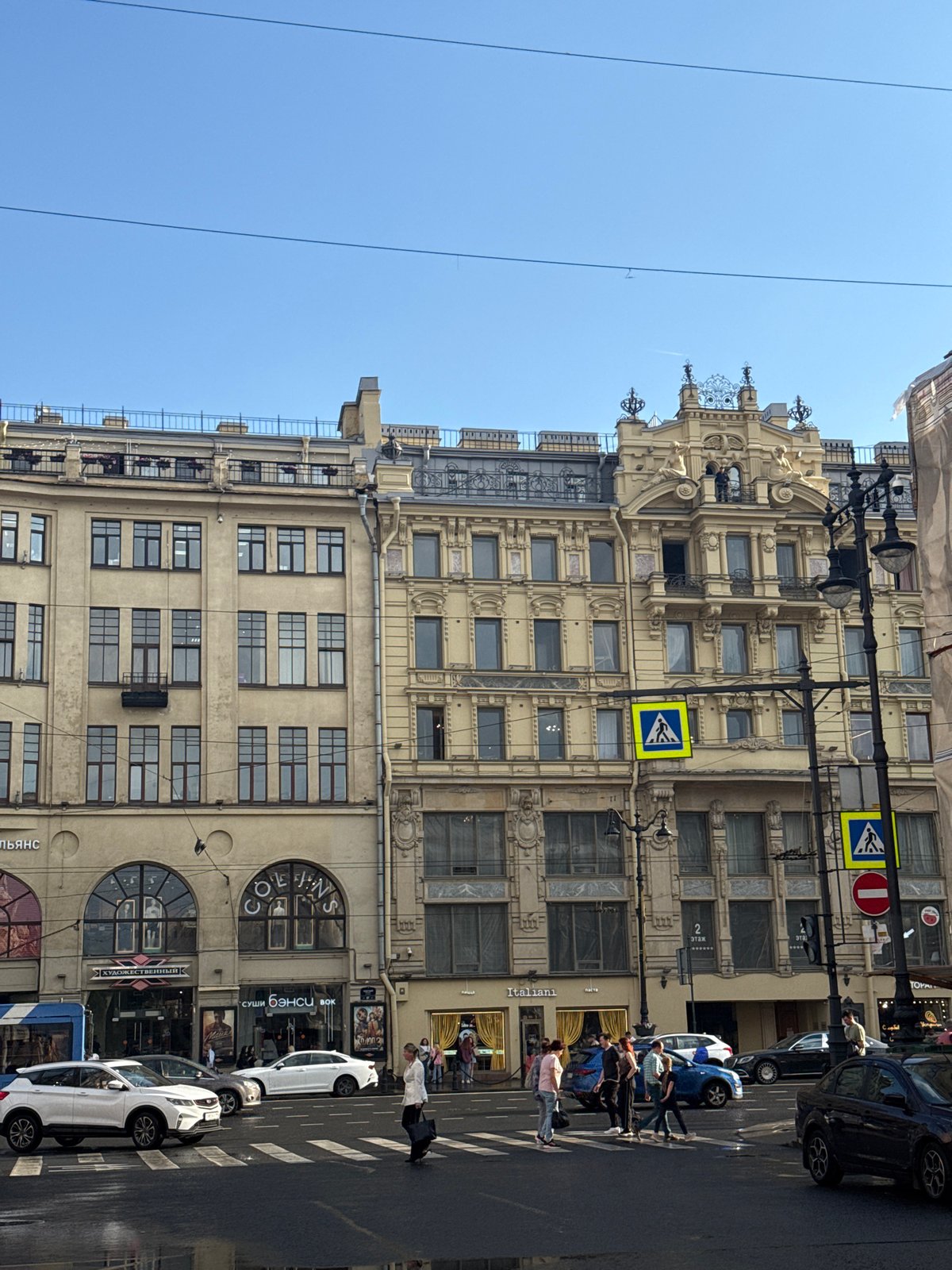 Rain-soaked afternoon unfolds along Saint Petersburg's Nevsky Prospekt