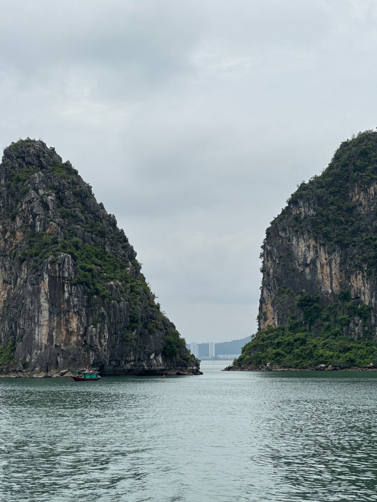 Boats navigating Ha Long Bay's karst-lined waters