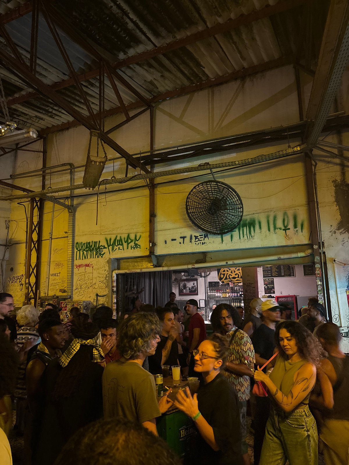 Late-night club scene with live band, DJ performance in São Paulo