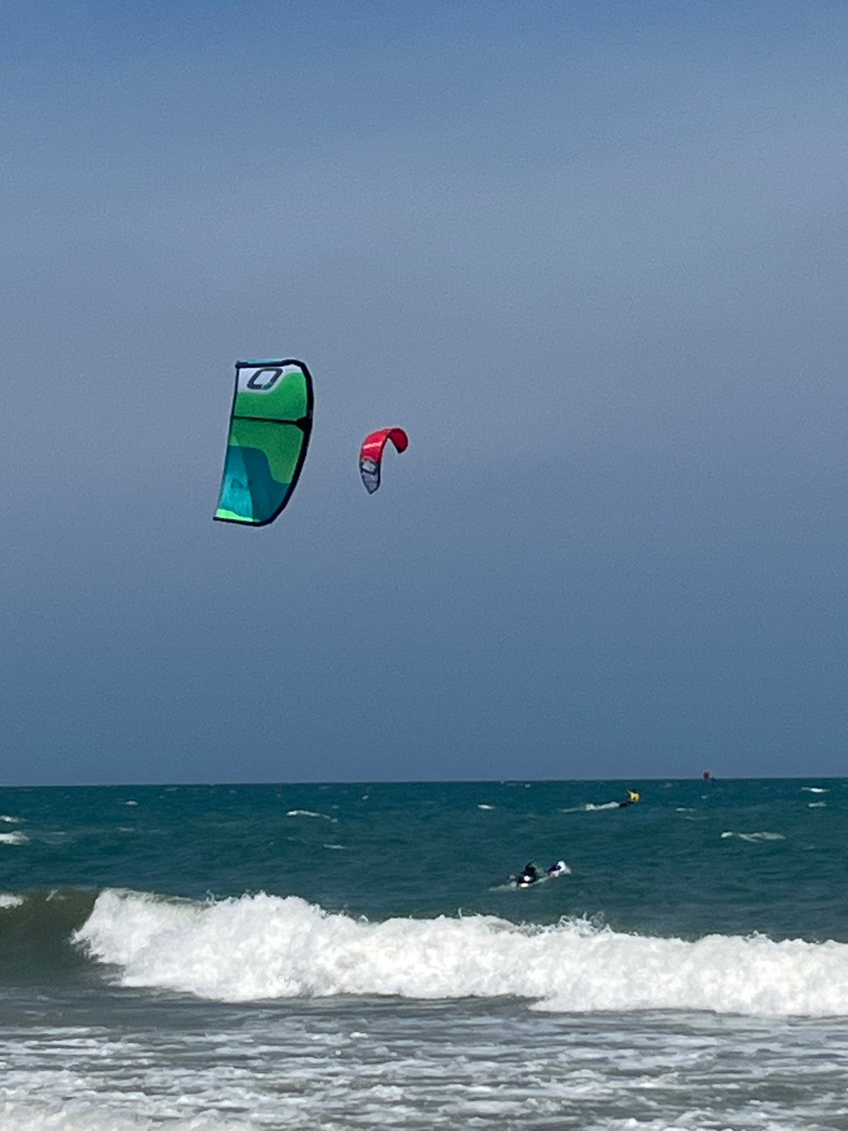 Breezy morning at Mui Ne with kite school action on the beach