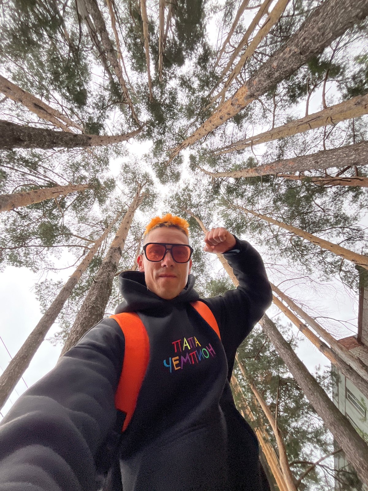 Bold orange aesthetic, multiple selfie angles, forest setting in Russia