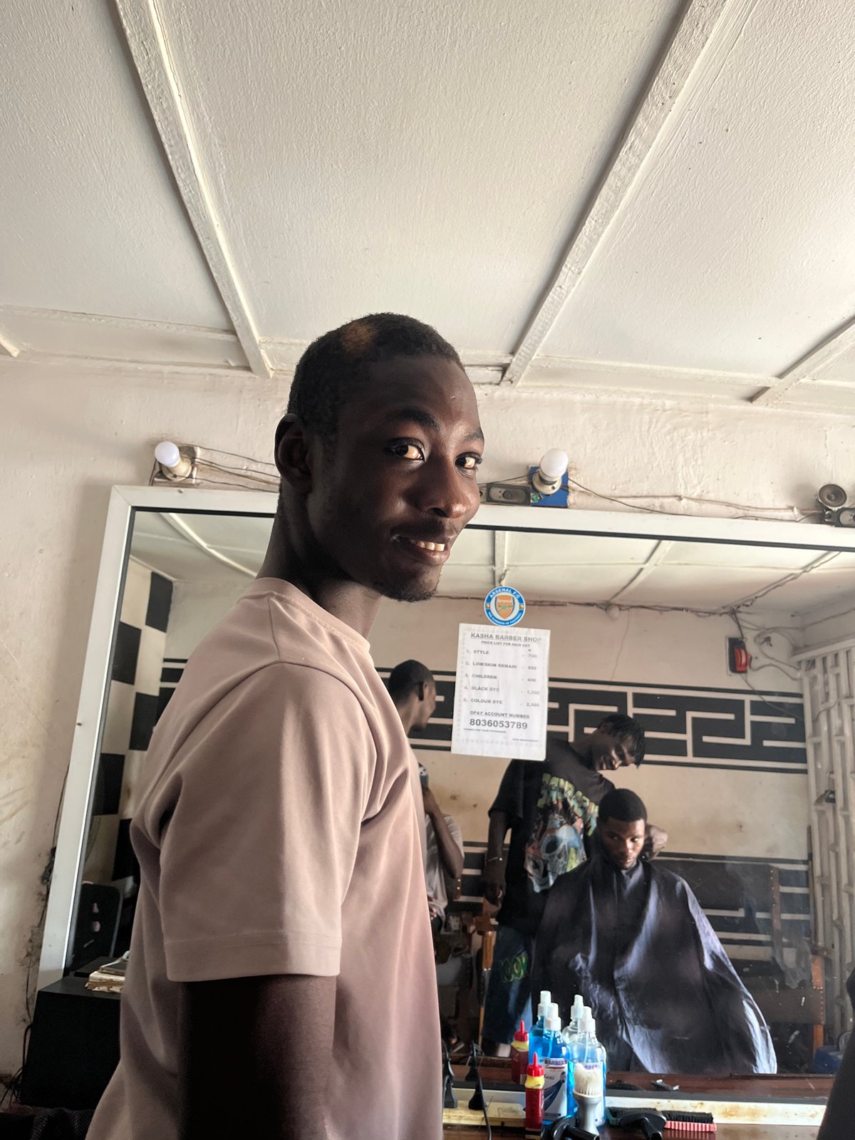 Daily life moments captured in Jos: barber shop, schoolchildren