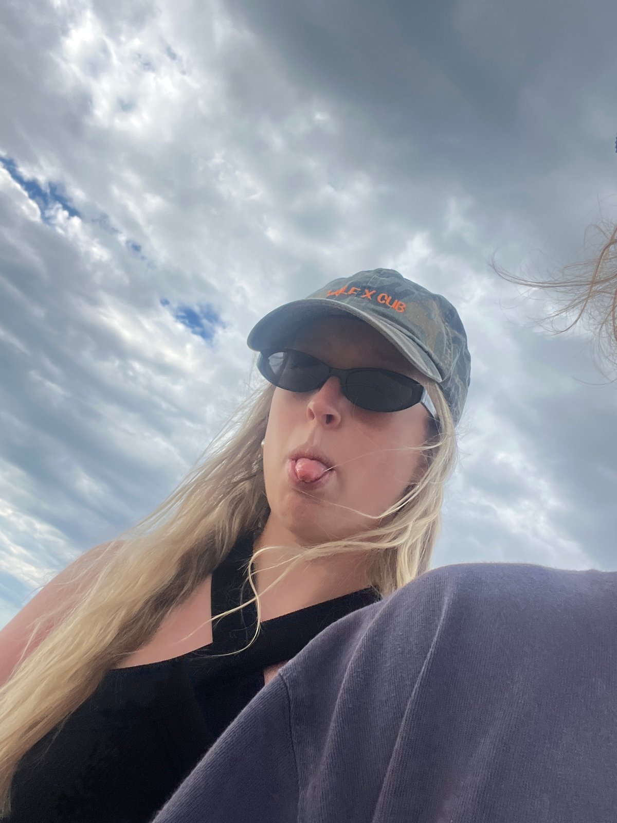 Beach scenes with children, dog captured during cloudy evening