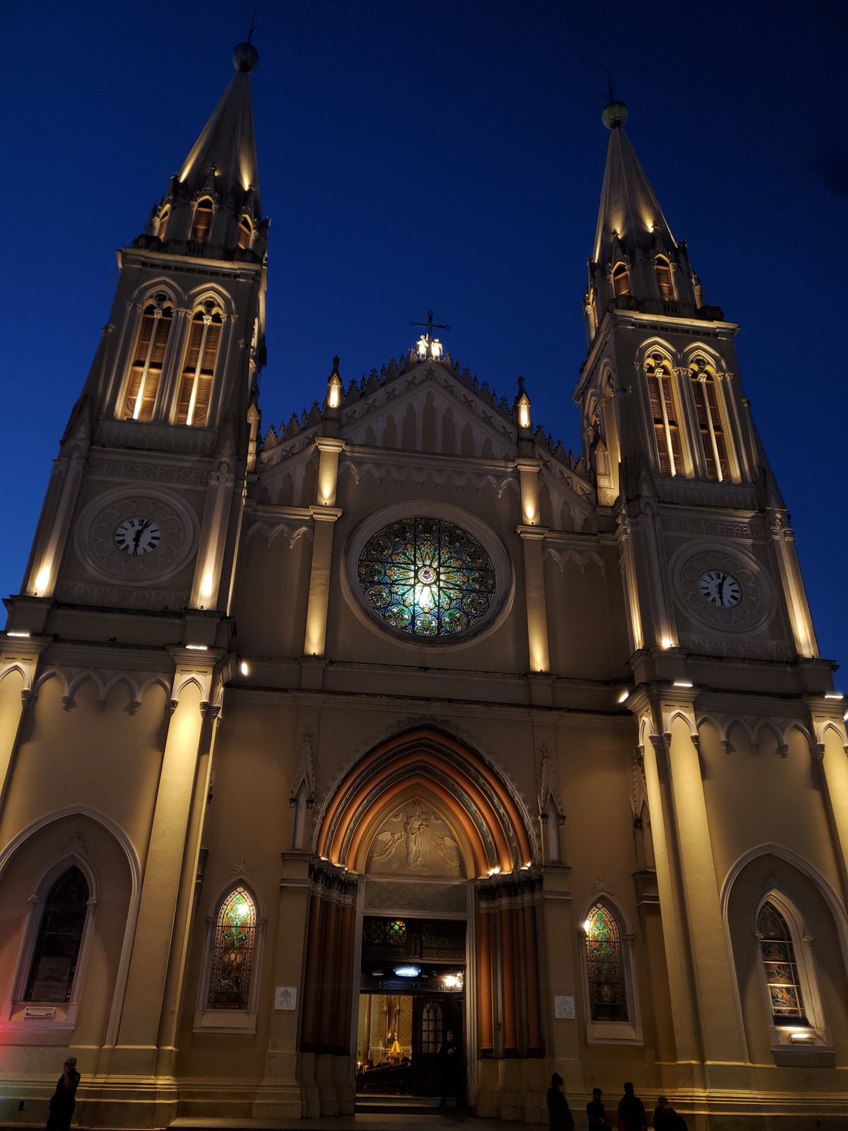 Dusk at Curitiba's cathedral square, mounted police patrolling nearby