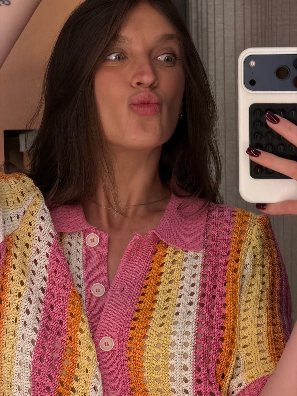 Mirror selfies in a Budva hotel room, colorful crochet top