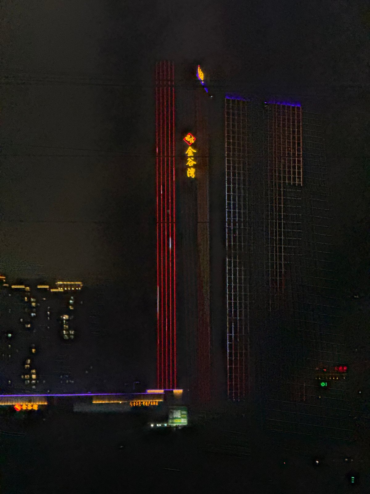 Aerial night view captures illuminated Liwan District buildings in Guangzhou