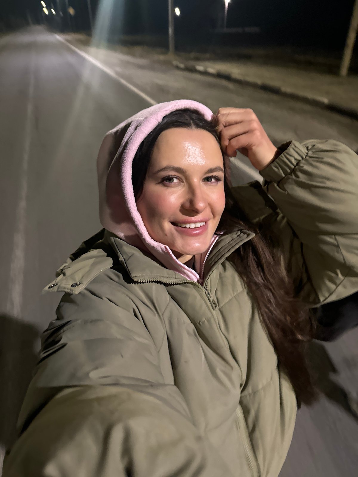 Woman poses for nighttime photos in Красный Маяк, Russia