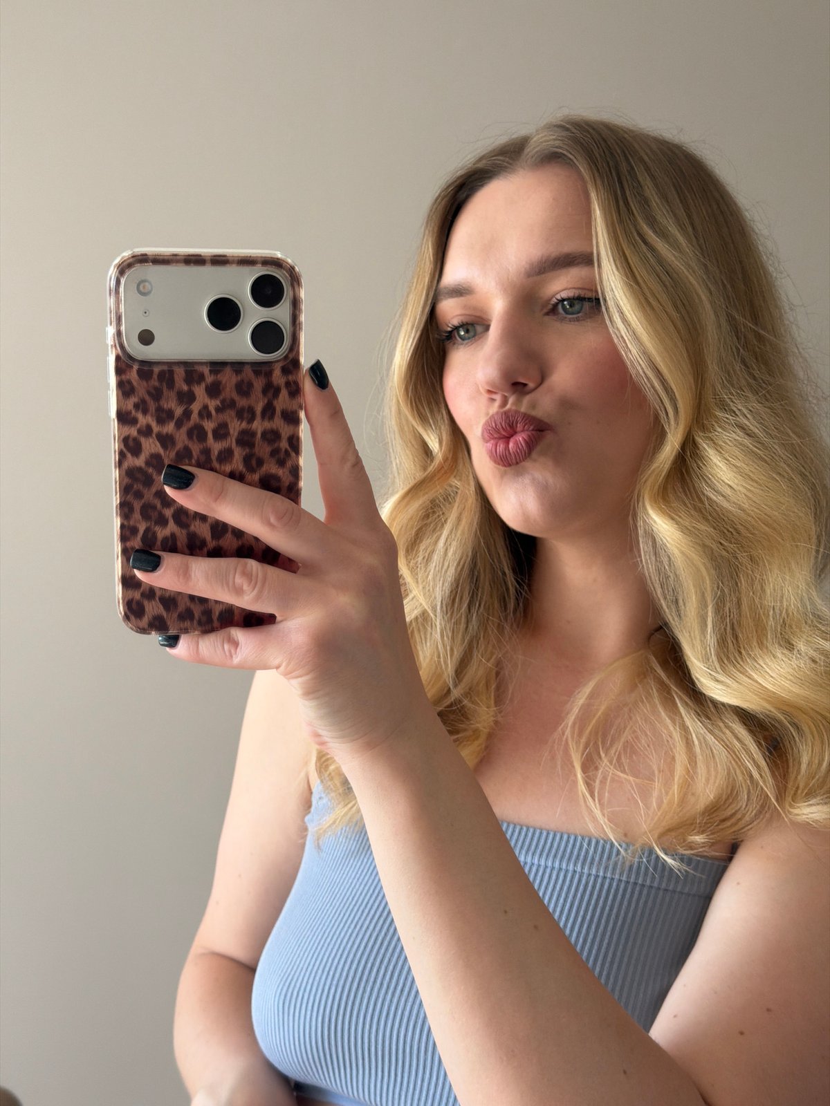 Woman takes multiple selfies in Dreiliņi, Latvia morning session