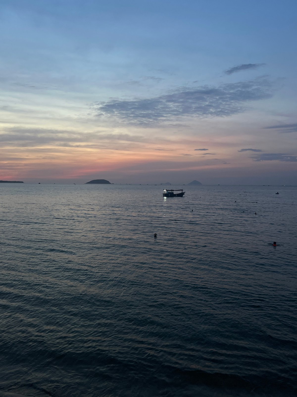 Evening waterfront gathering captured in Nha Trang, Vietnam