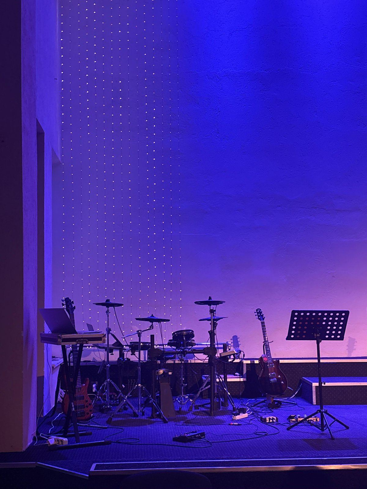 Music event underway at a lit-up indoor venue in Vitsebsk