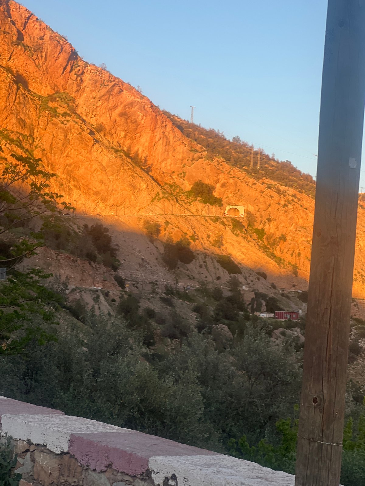 Sunset illuminates mountains and dam at Bin El Ouidane, Morocco
