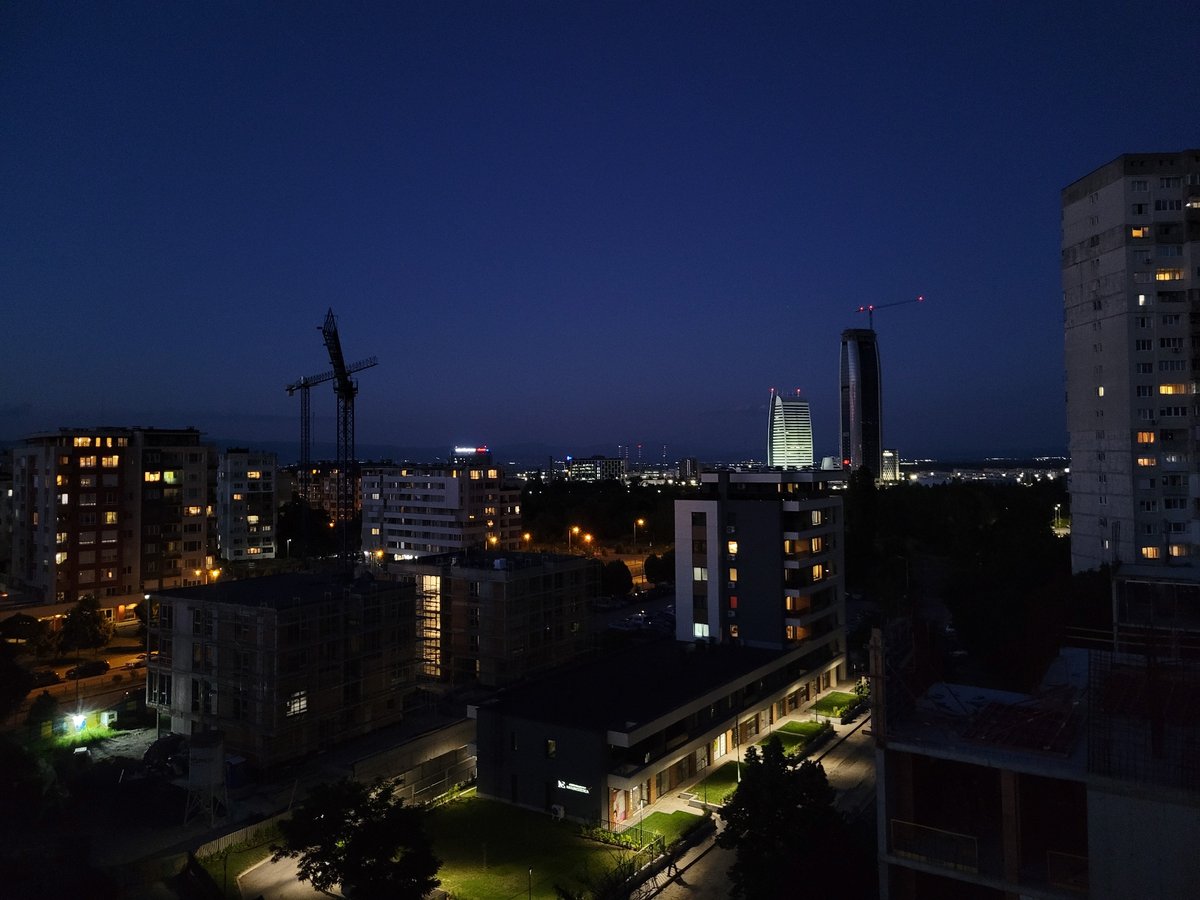 Sofia skyline at dusk, construction and city lights