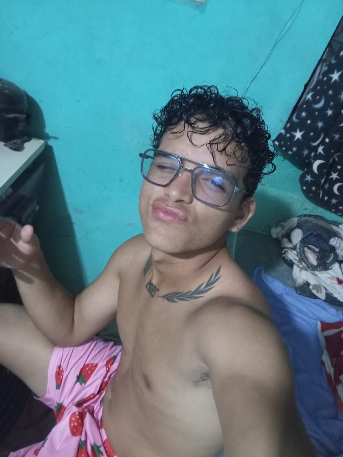 Young man documents evening moments in Venezuelan home selfies