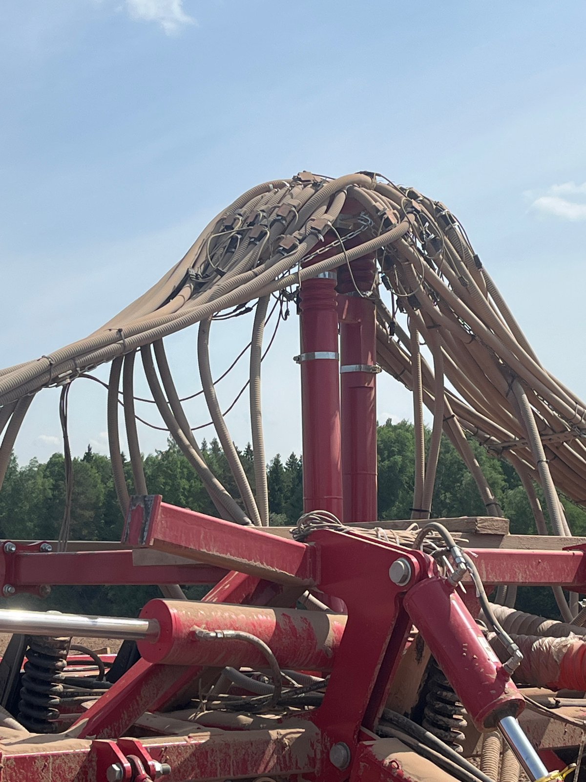 Spring planting operations documented with tractor and seeding equipment