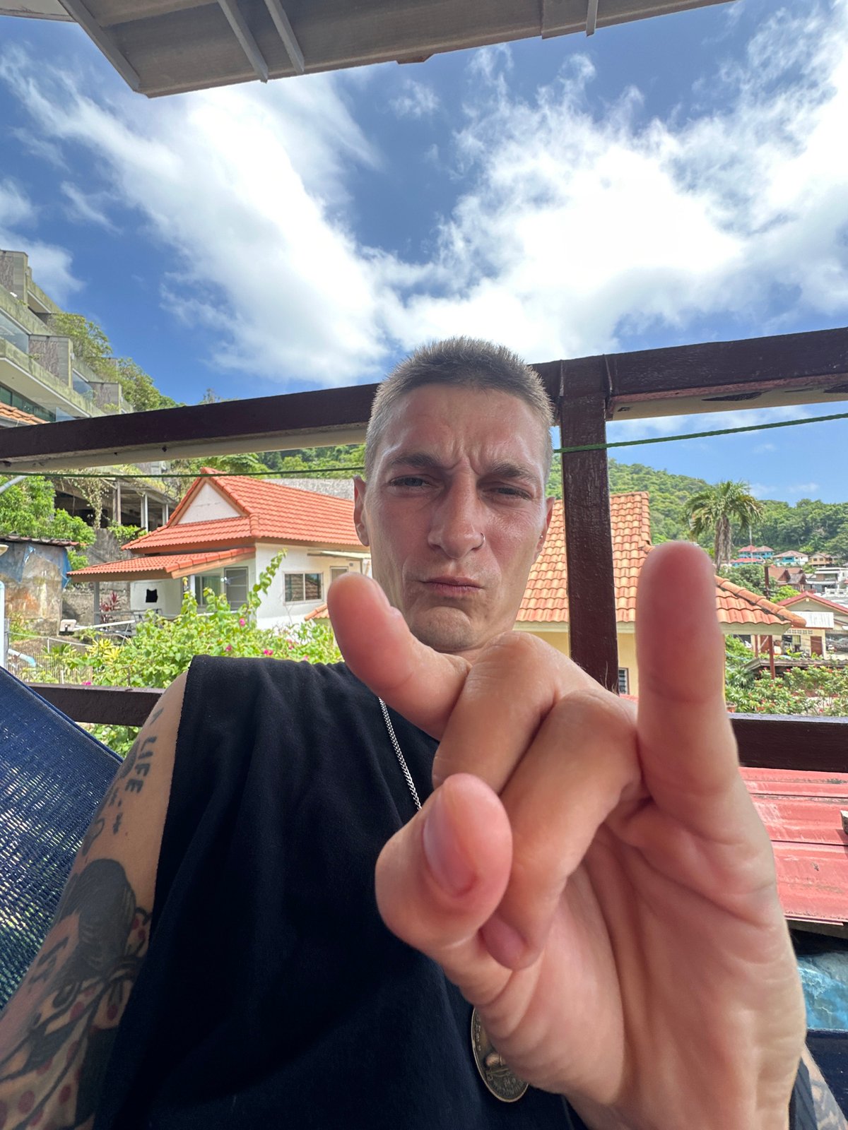 Lazy balcony morning in Karon, tattoos and rooftop views