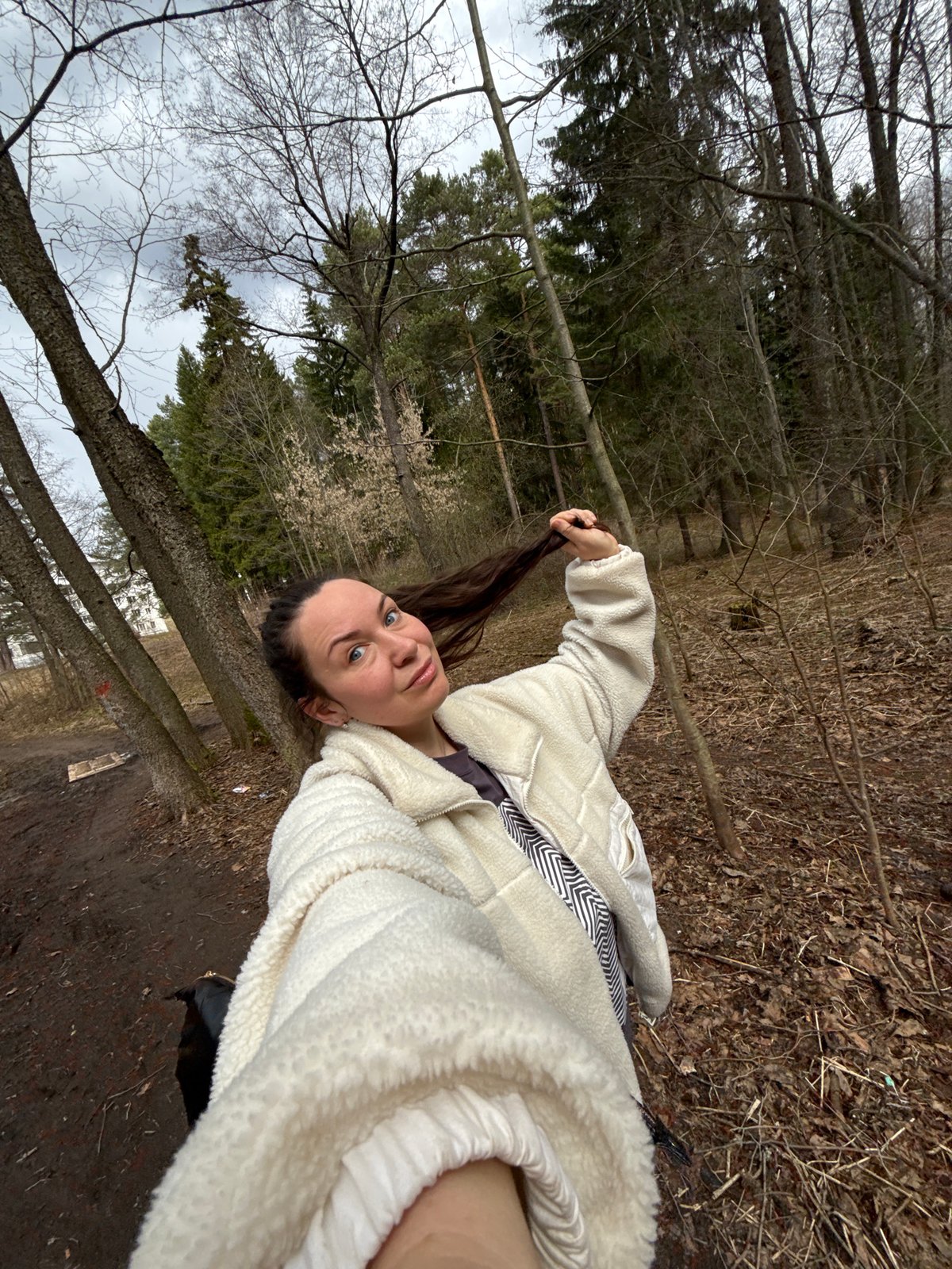 Woman photographed in forest setting during brief outdoor session