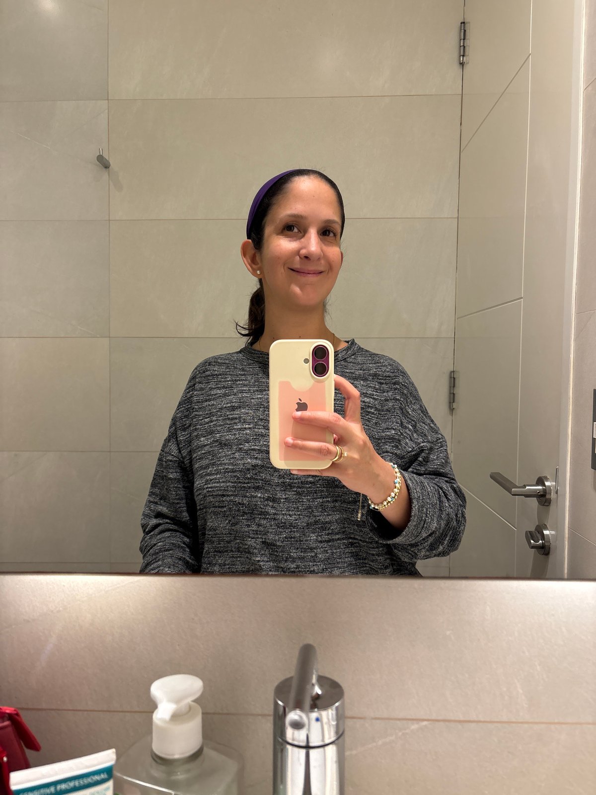 Woman Takes Bathroom Mirror Selfies in San Isidro