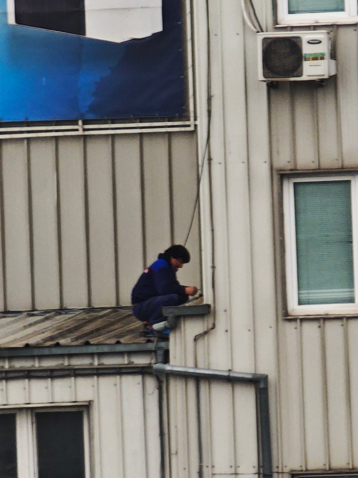 Worker spotted on building rooftop in Varna, Bulgaria