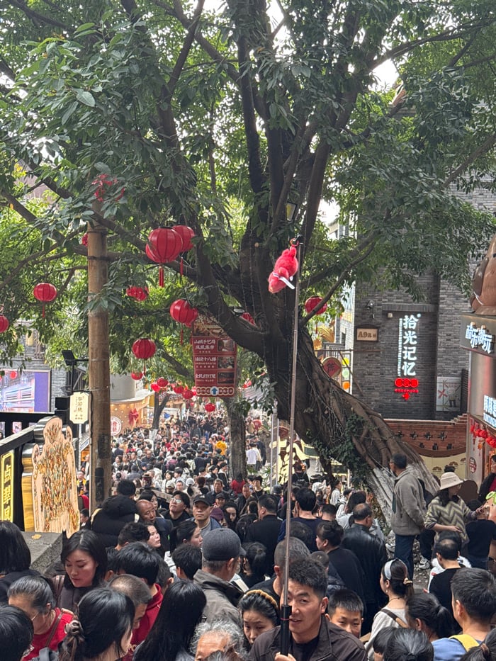 Festival crowds pack decorated streets in Chongqing's Yuzhong District