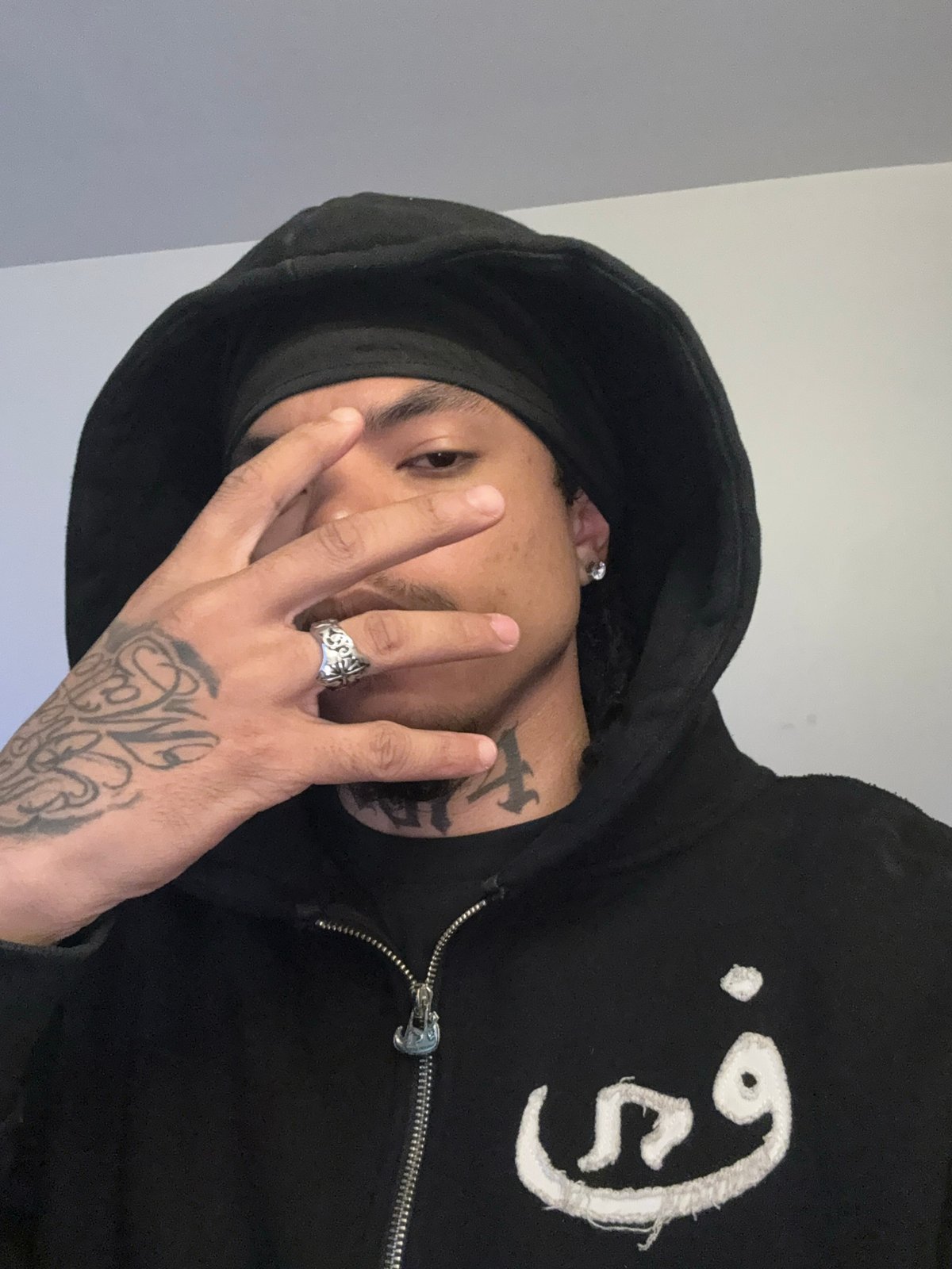 Person in black hoodie observed indoors in Massy, France