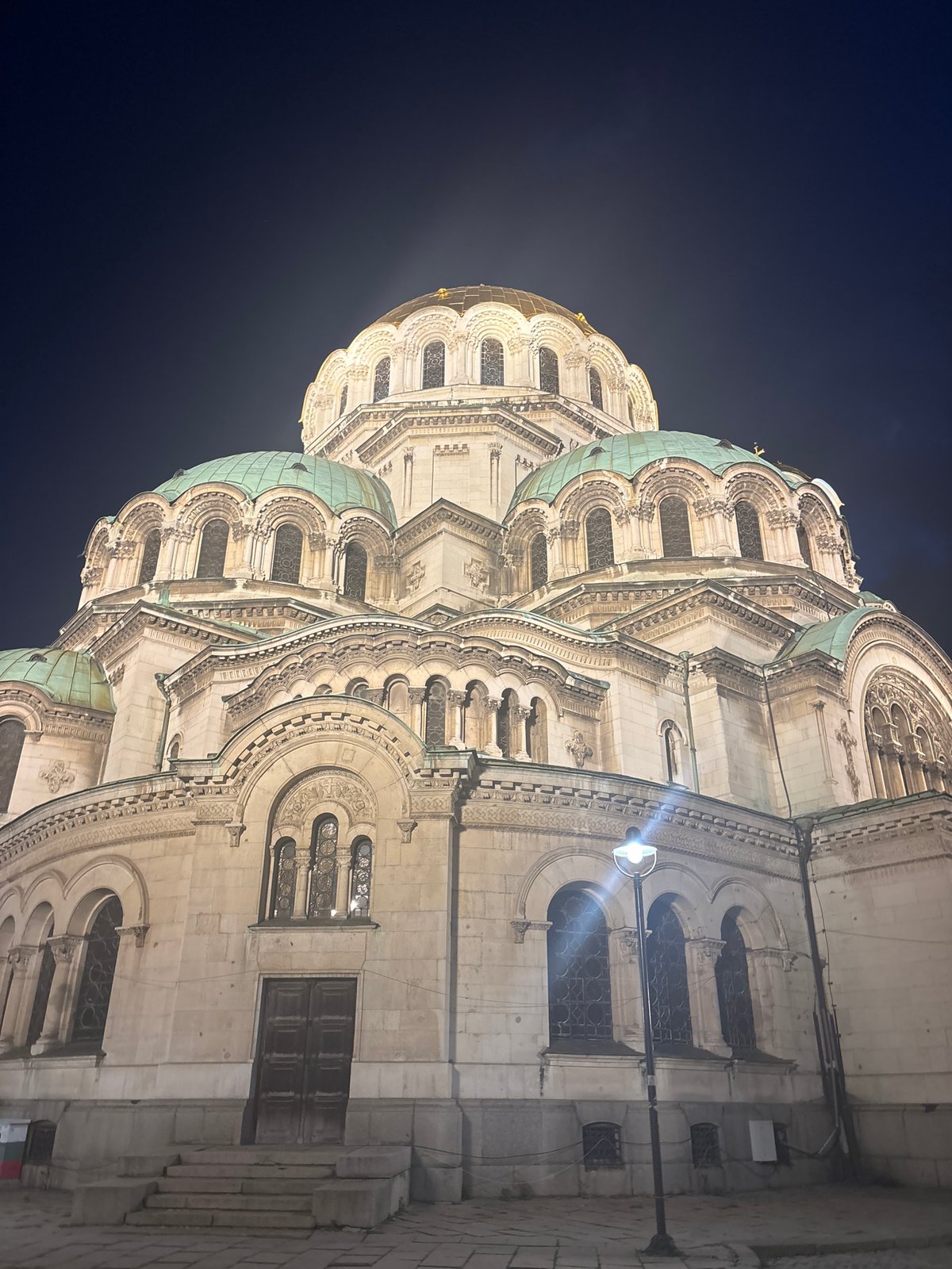 Nighttime photography session captures illuminated Sofia cathedral and buildings