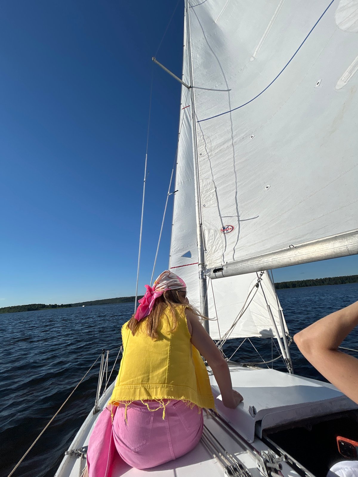 Sailing on calm water near Izhevsk on a clear summer day
