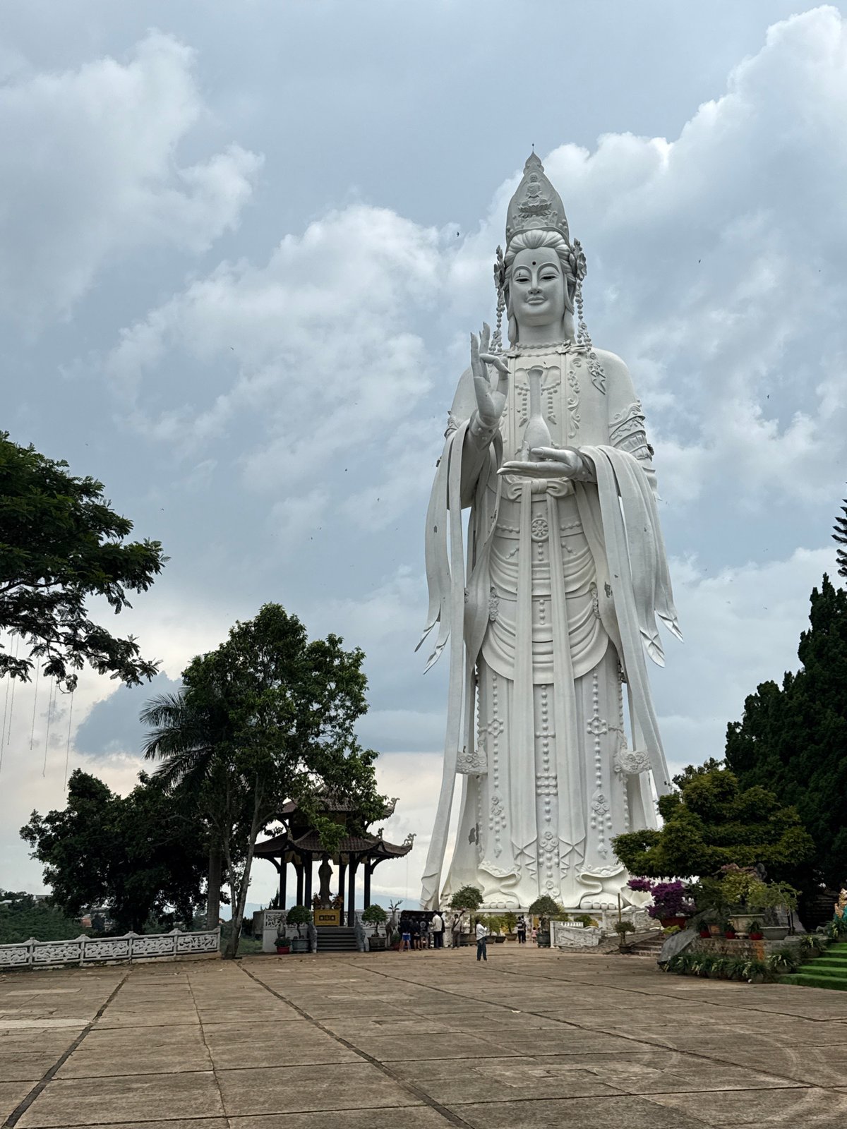 Buddhist statues and waterfalls at a Nam Ban spiritual site