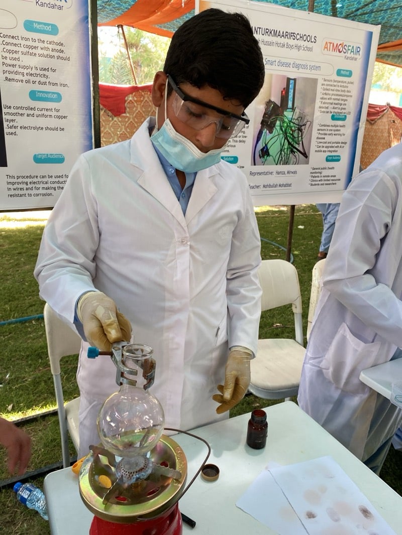 Students showcase science projects at outdoor fair in Kandahar