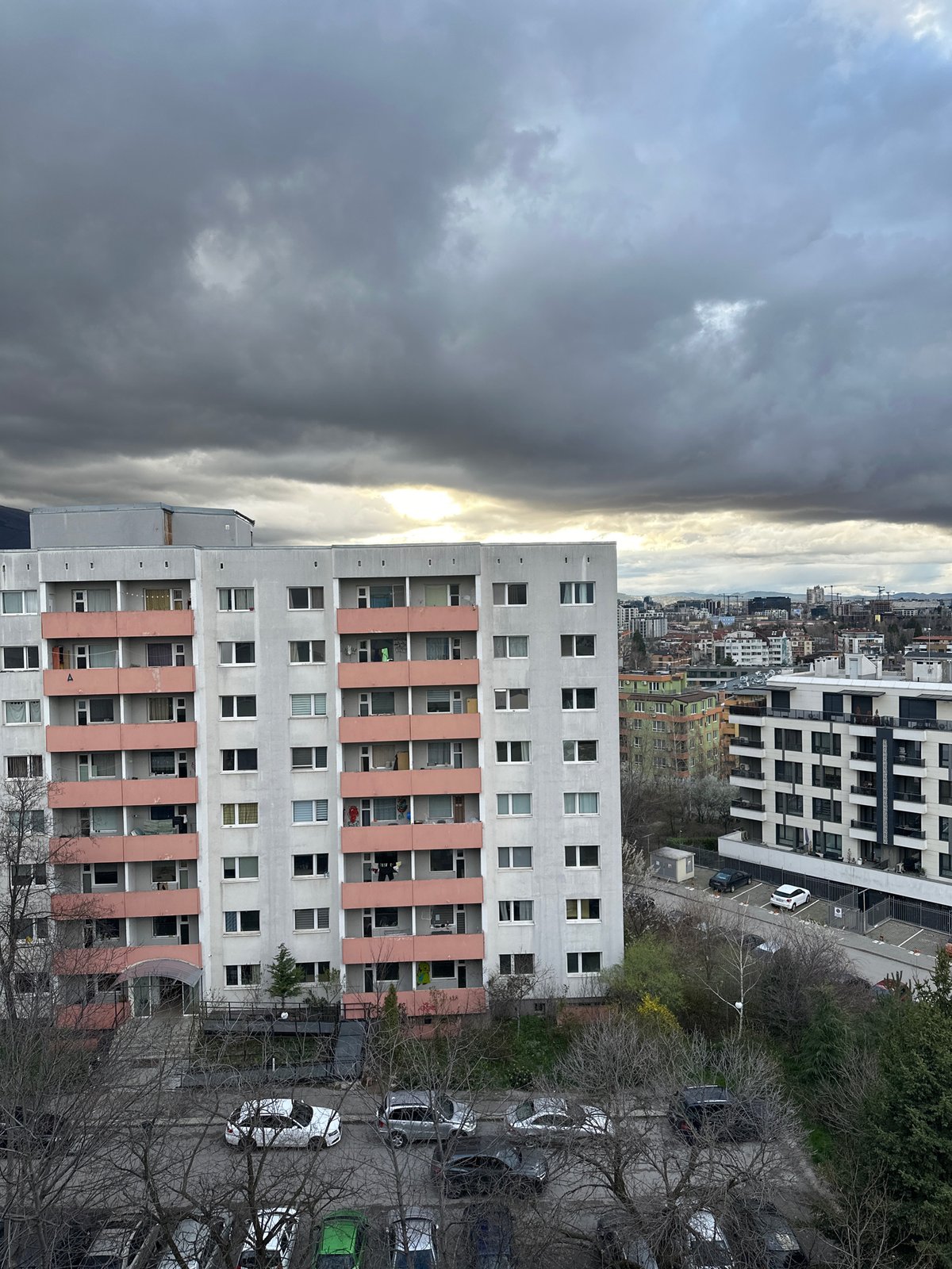 Afternoon sunlight breaks through clouds over Sofia residential area