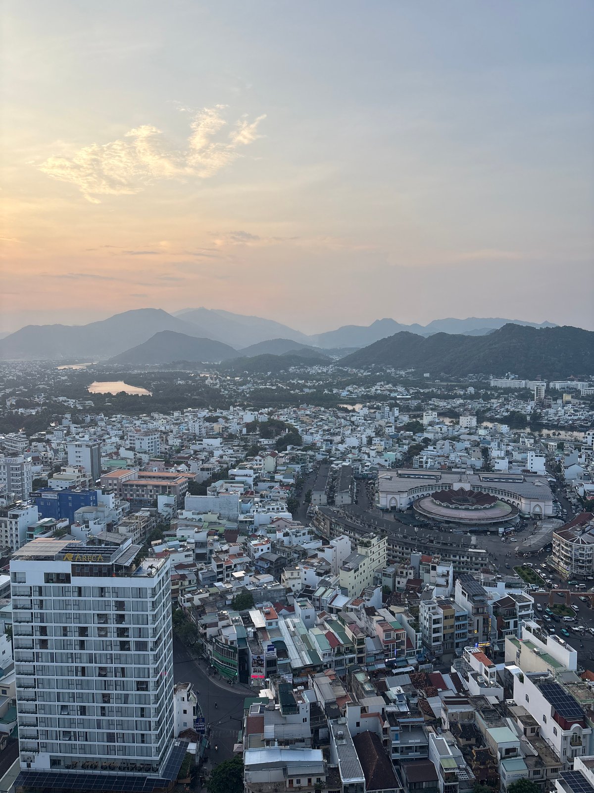 Tourist documents daily life scenes across Nha Trang Ward