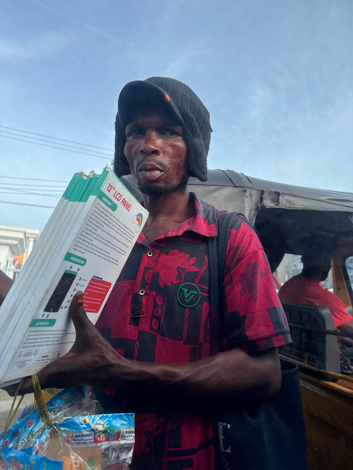 Street vendors conduct afternoon business in Ado, Nigeria