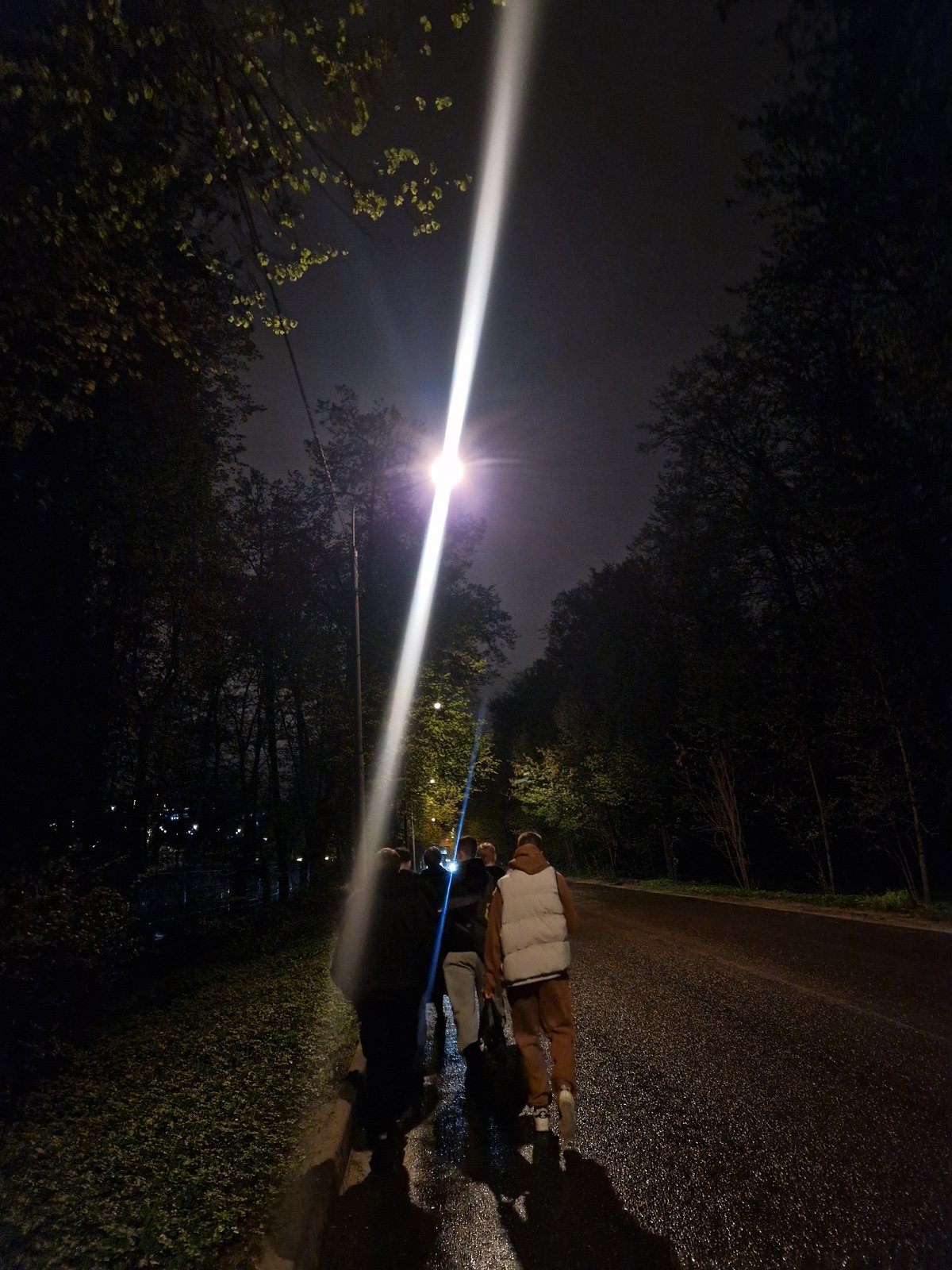 Group directs light beams on wet Moscow pathway