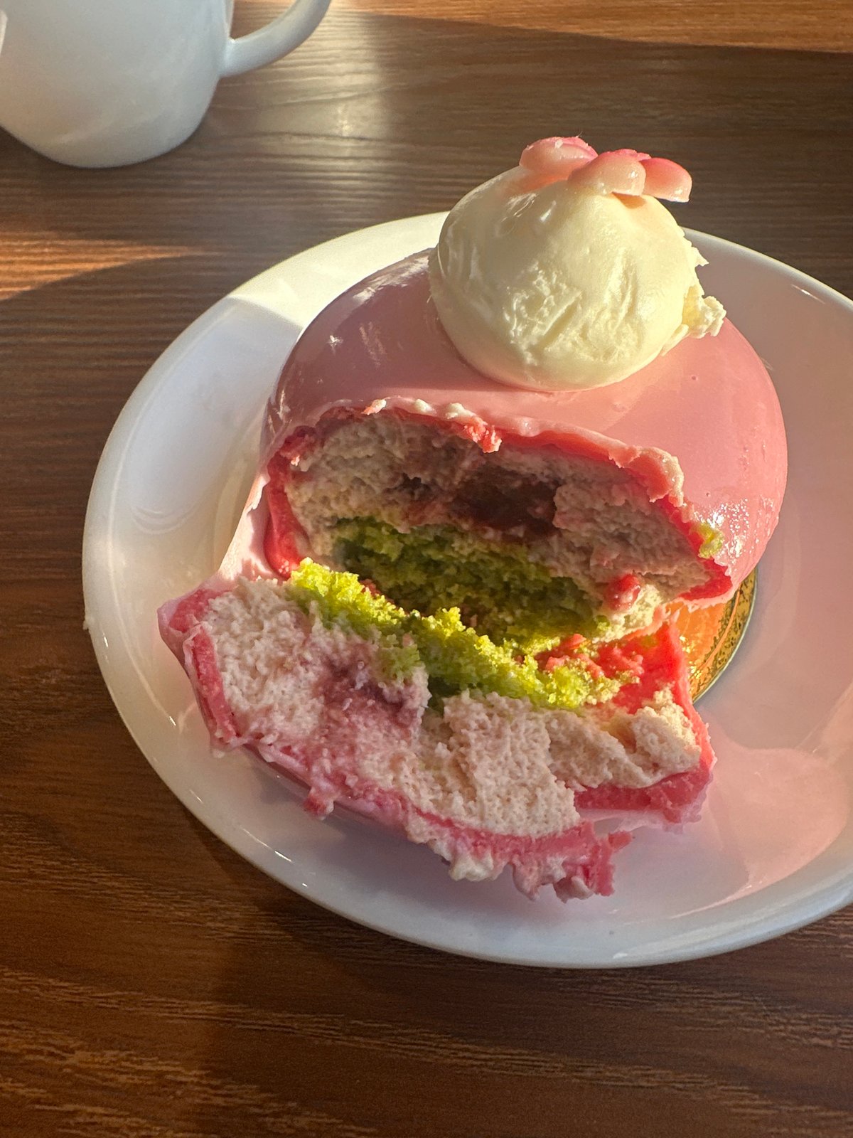 Pink dome dessert cut and served in Moscow