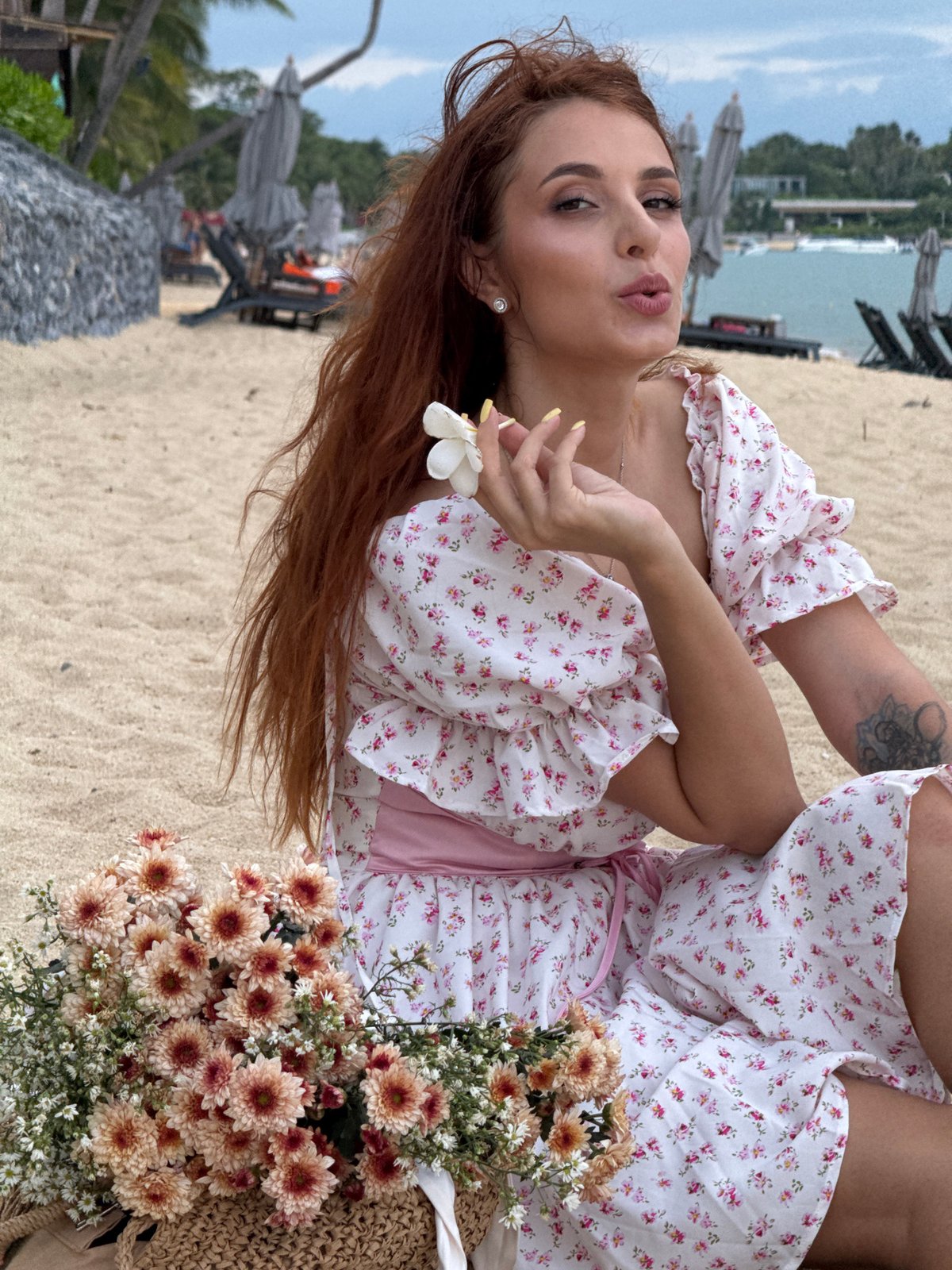 Floral dress and flowers on a Ko Samui beach