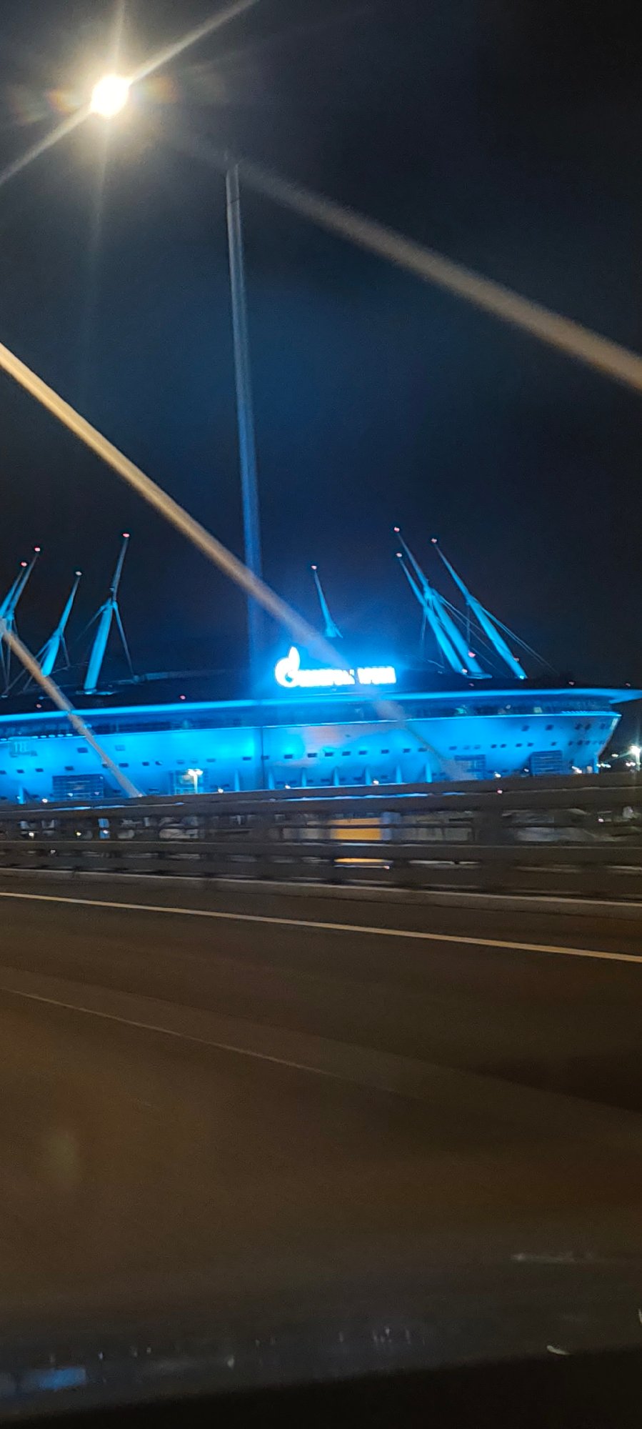Gazprom Arena and cable-stayed bridge lit up at night