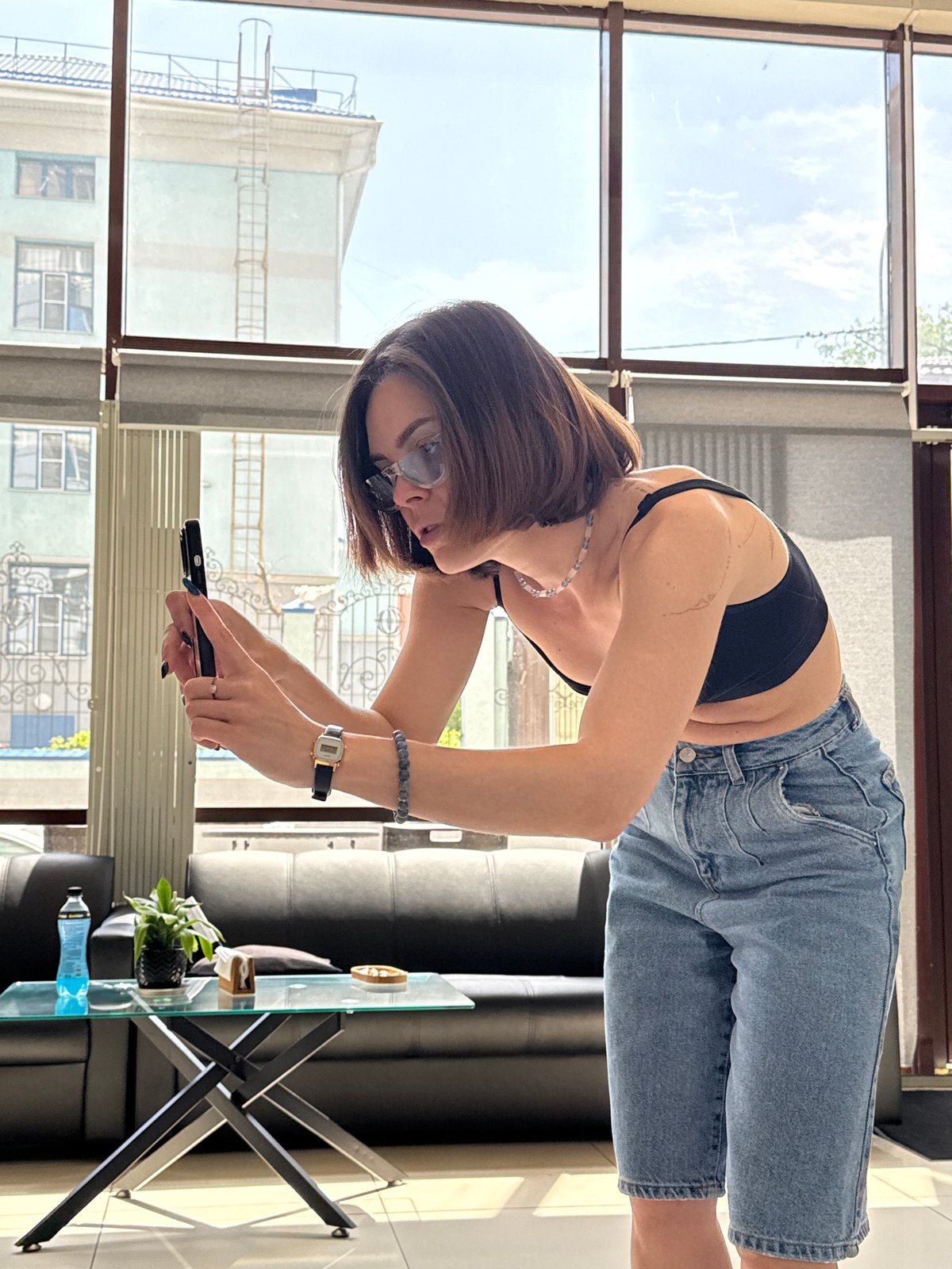 Woman photographed using smartphone in Rostov-on-Don indoor space