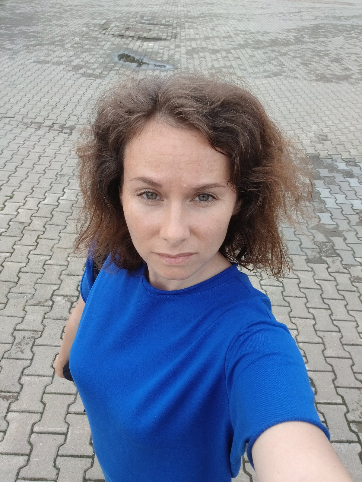 Selfie and cityscape from a rainy Yekaterinburg square