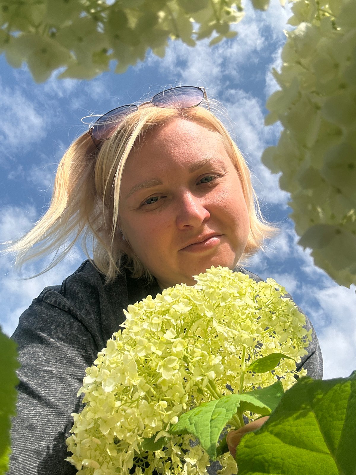 Outdoor selfie session among blooming flowers in Chaikovsky, Russia
