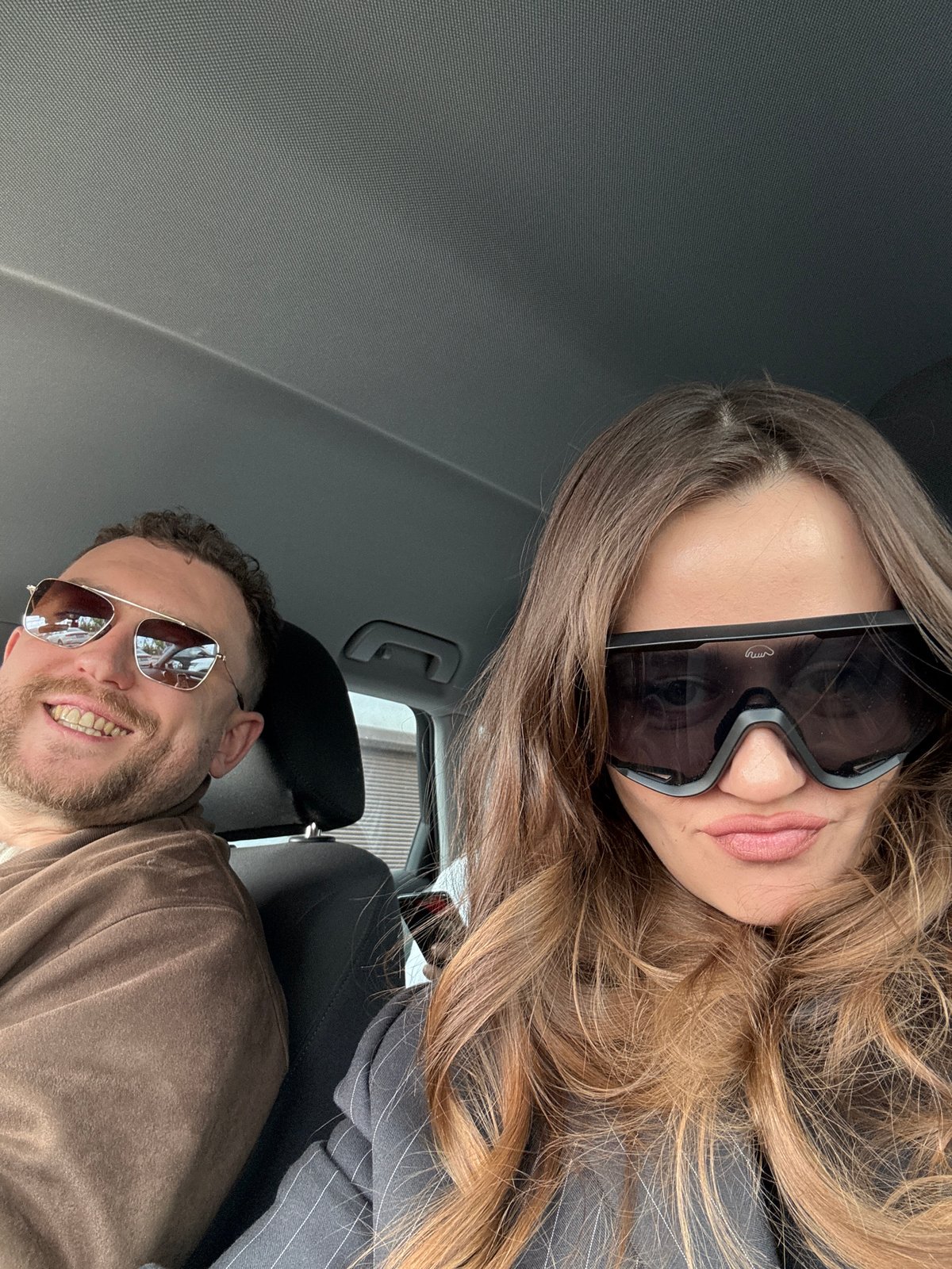 Couple takes selfie in vehicle in Krasnoyarsk, Russia