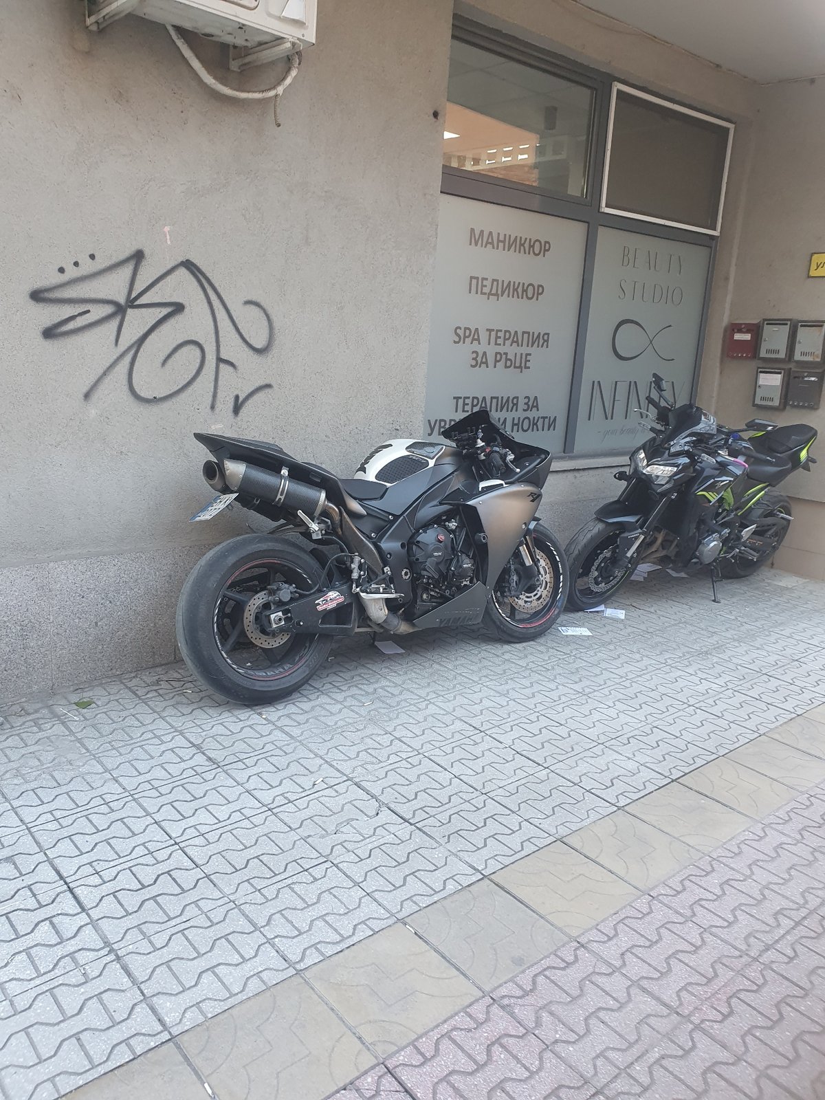 Motorcycles parked outside beauty studio in Plovdiv, Bulgaria