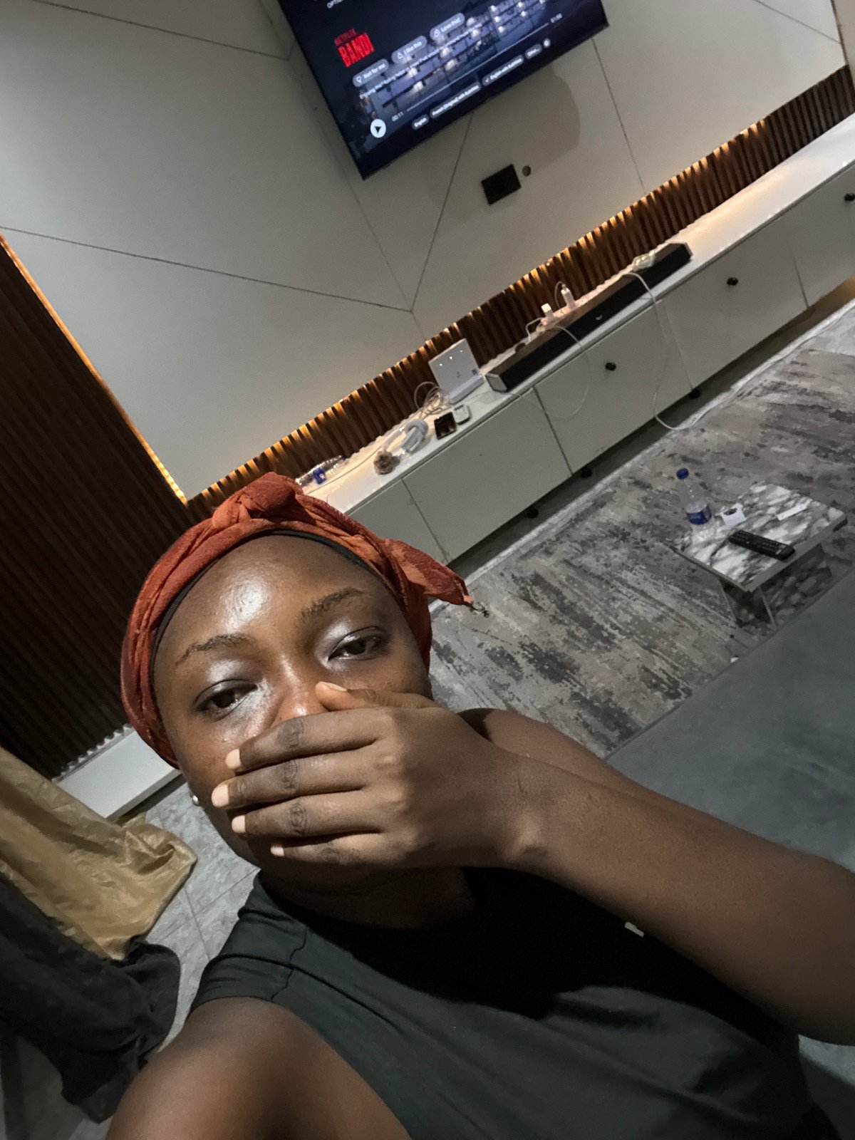 Woman watches Netflix at home in Nigeria evening