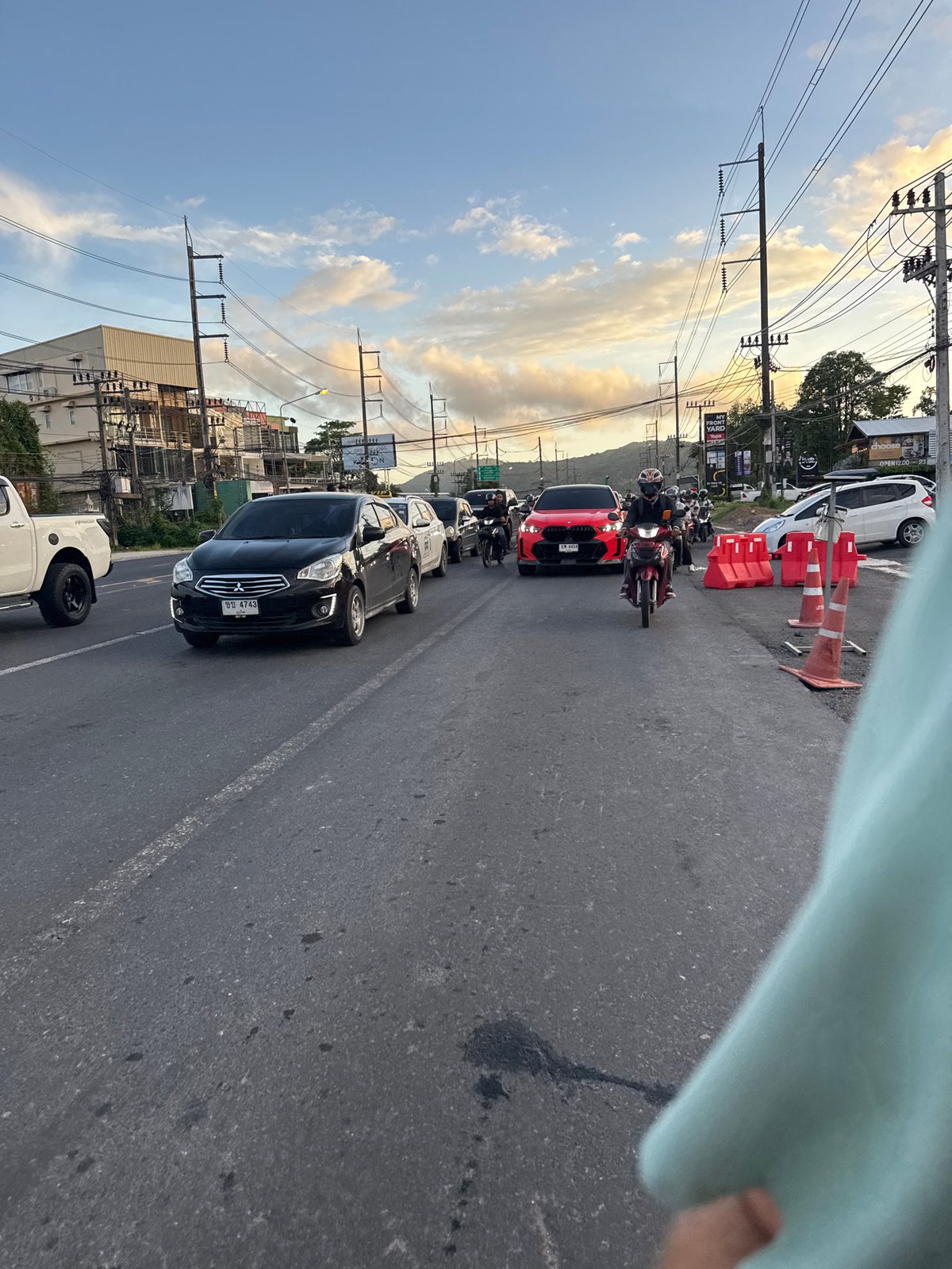 Traffic scenes documented in Wichit, Thailand including emergency ambulance