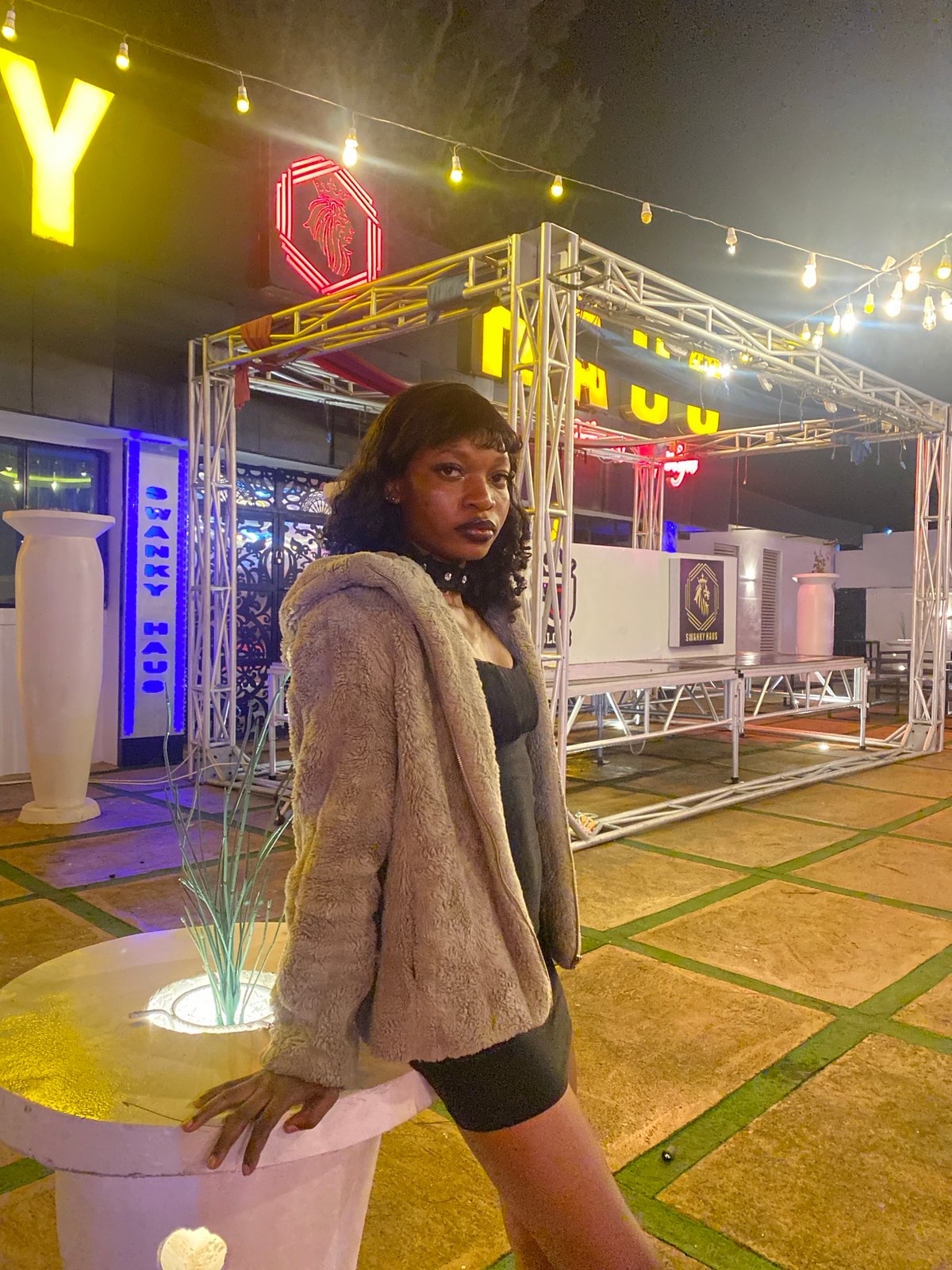 Dressed up for a night out at an outdoor venue in Nigeria