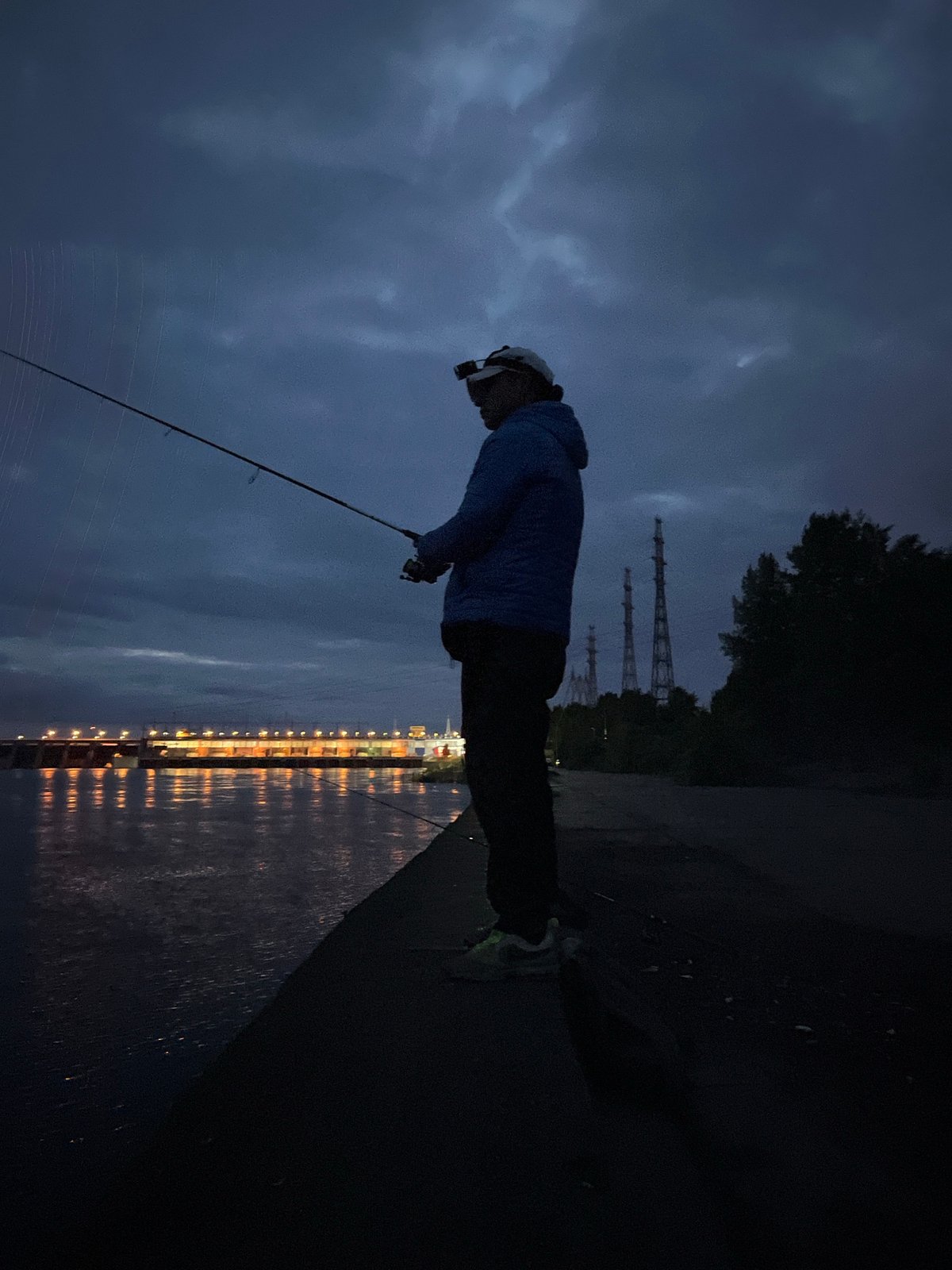 Night fishing session near power plant in Chaikovsky, Russia