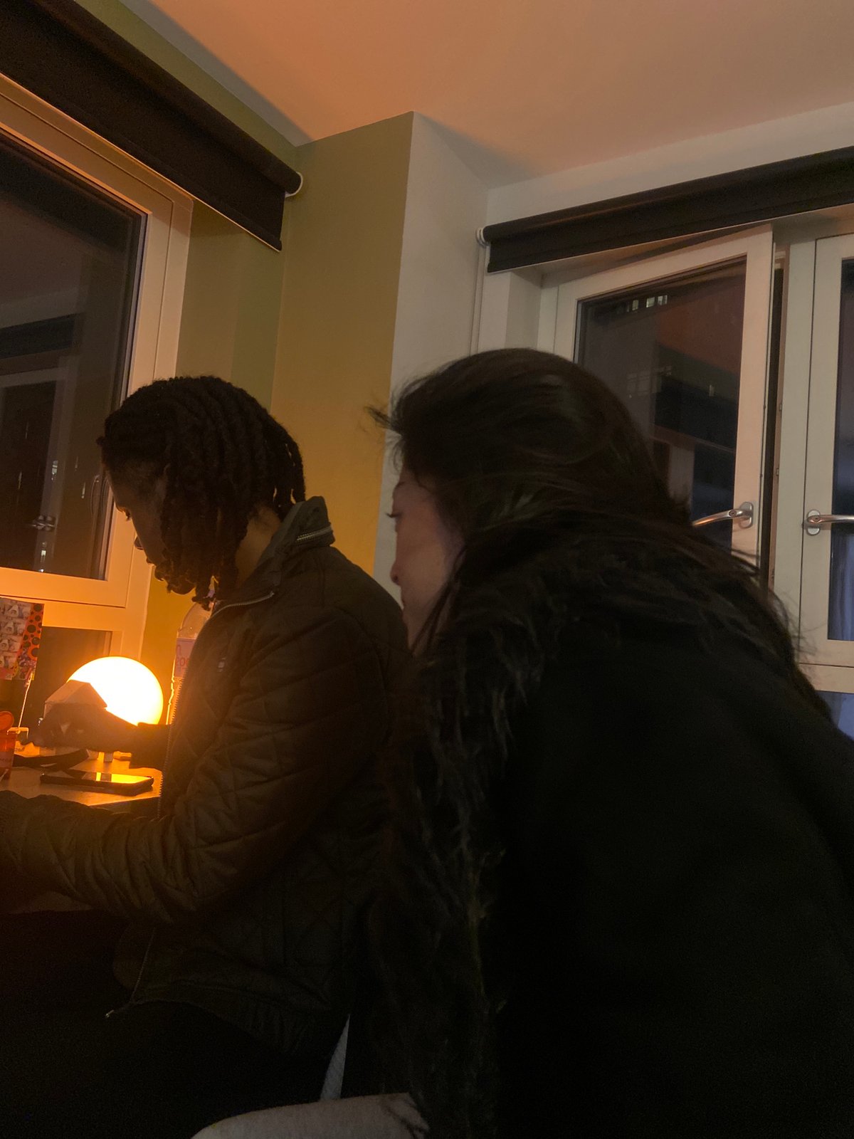 Two people spotted in dimly lit London room