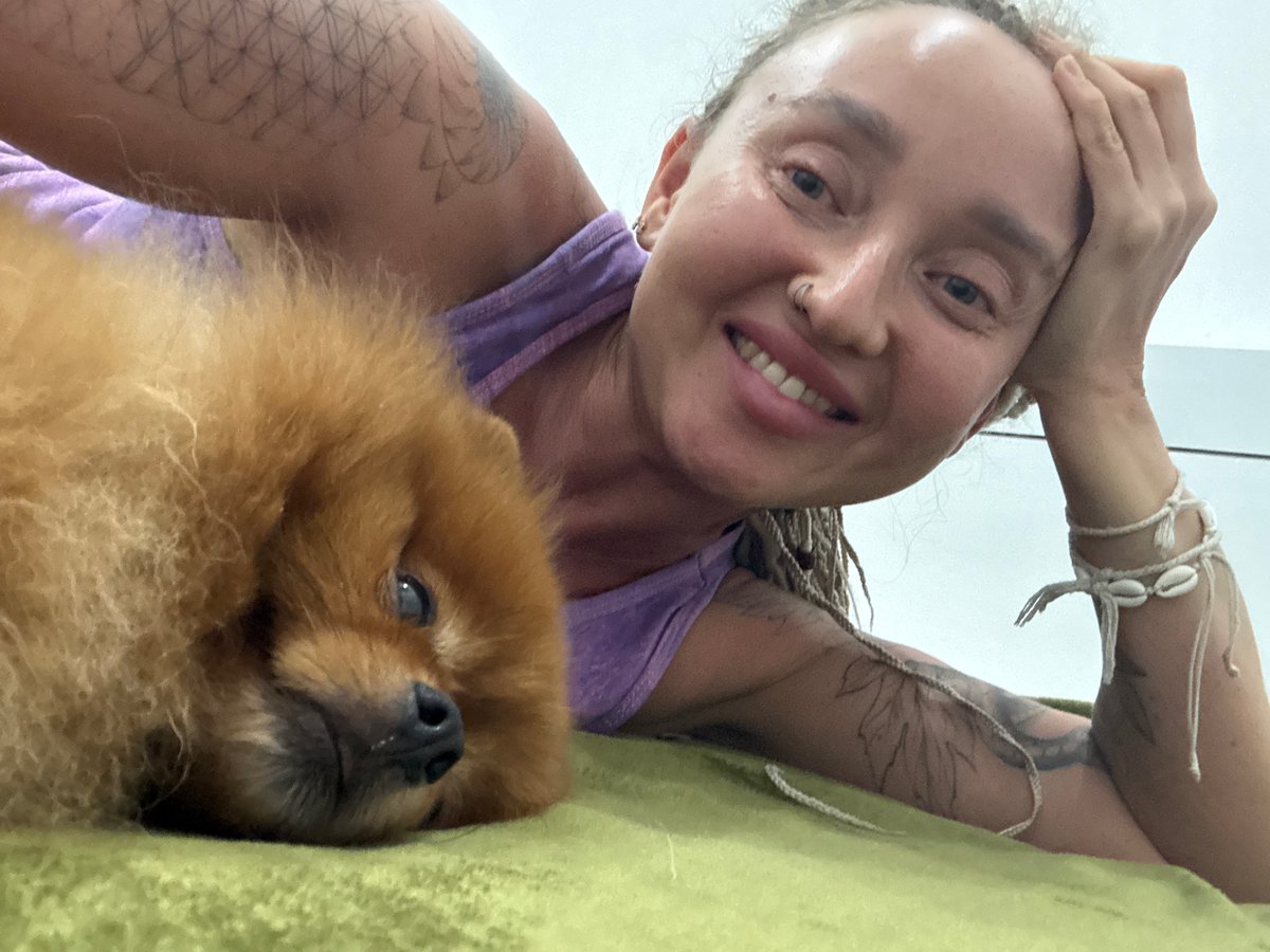 Lazy afternoon on a green blanket with a sleeping Pomeranian in Nha Trang