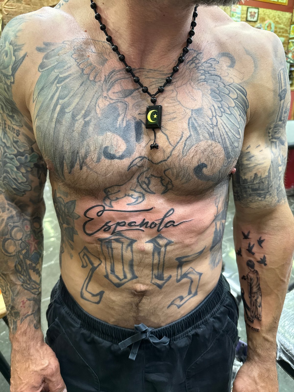 Heavily tattooed individual photographed indoors in Moscow