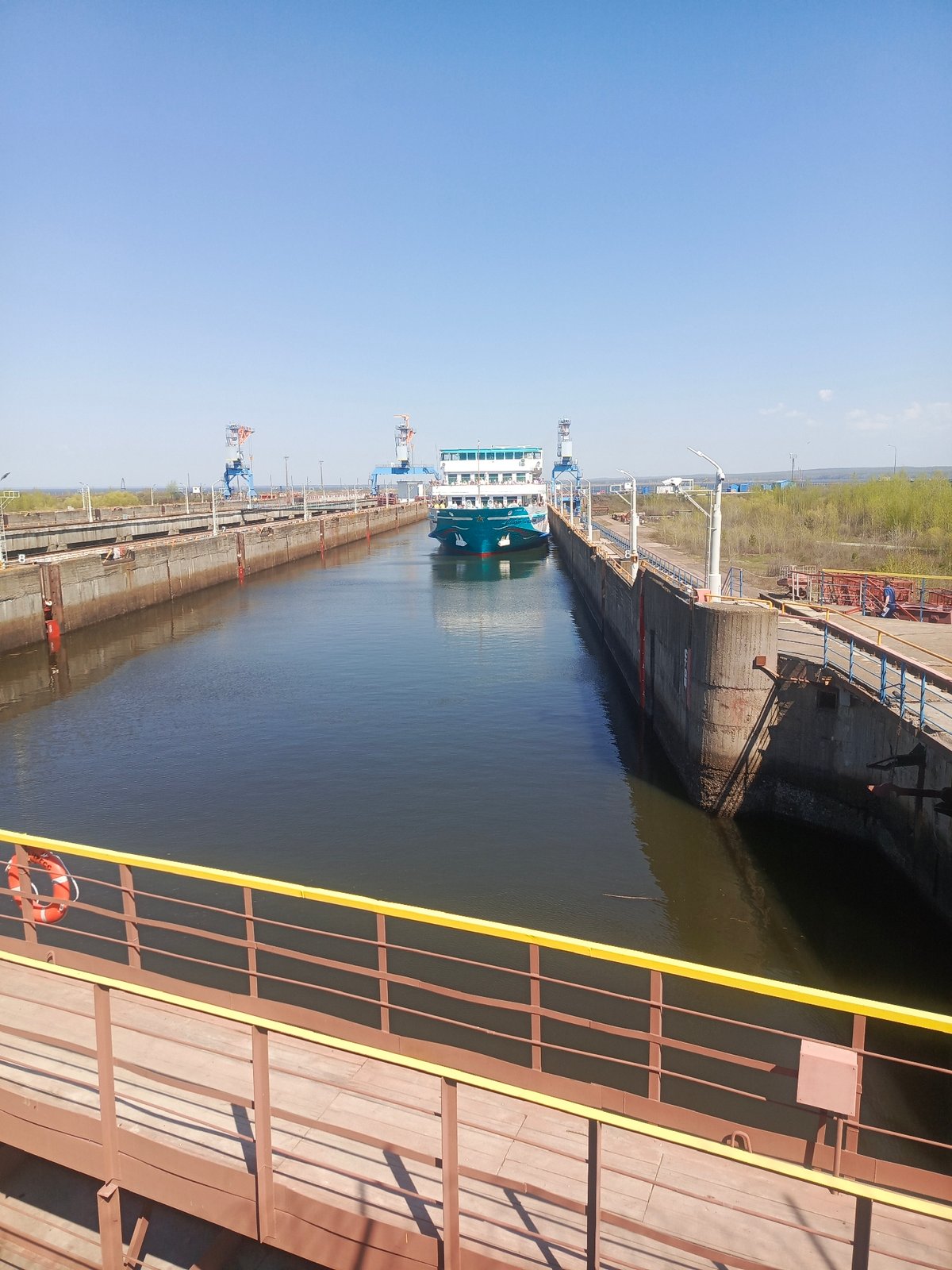 Ship transits locks on Kama River in Chaikovsky, Russia