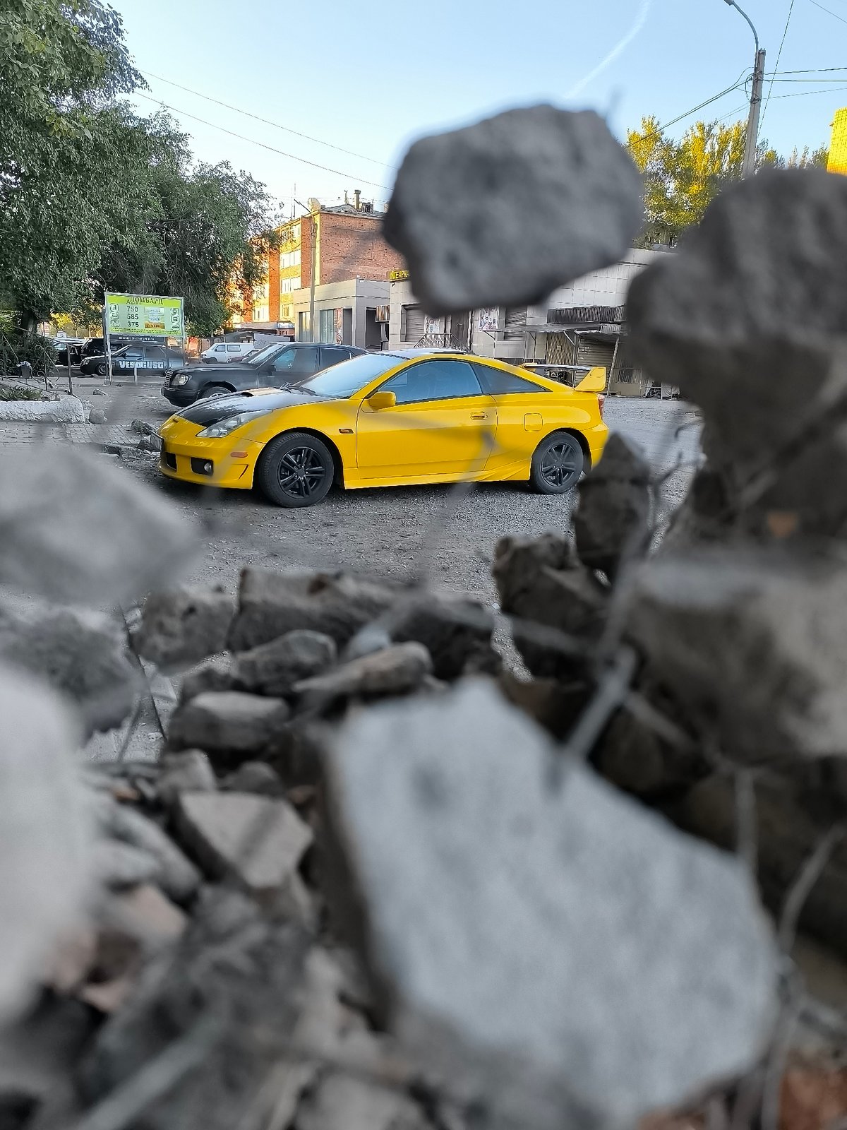 Two-tone Toyota Celica parked outside Qarağandı city administration